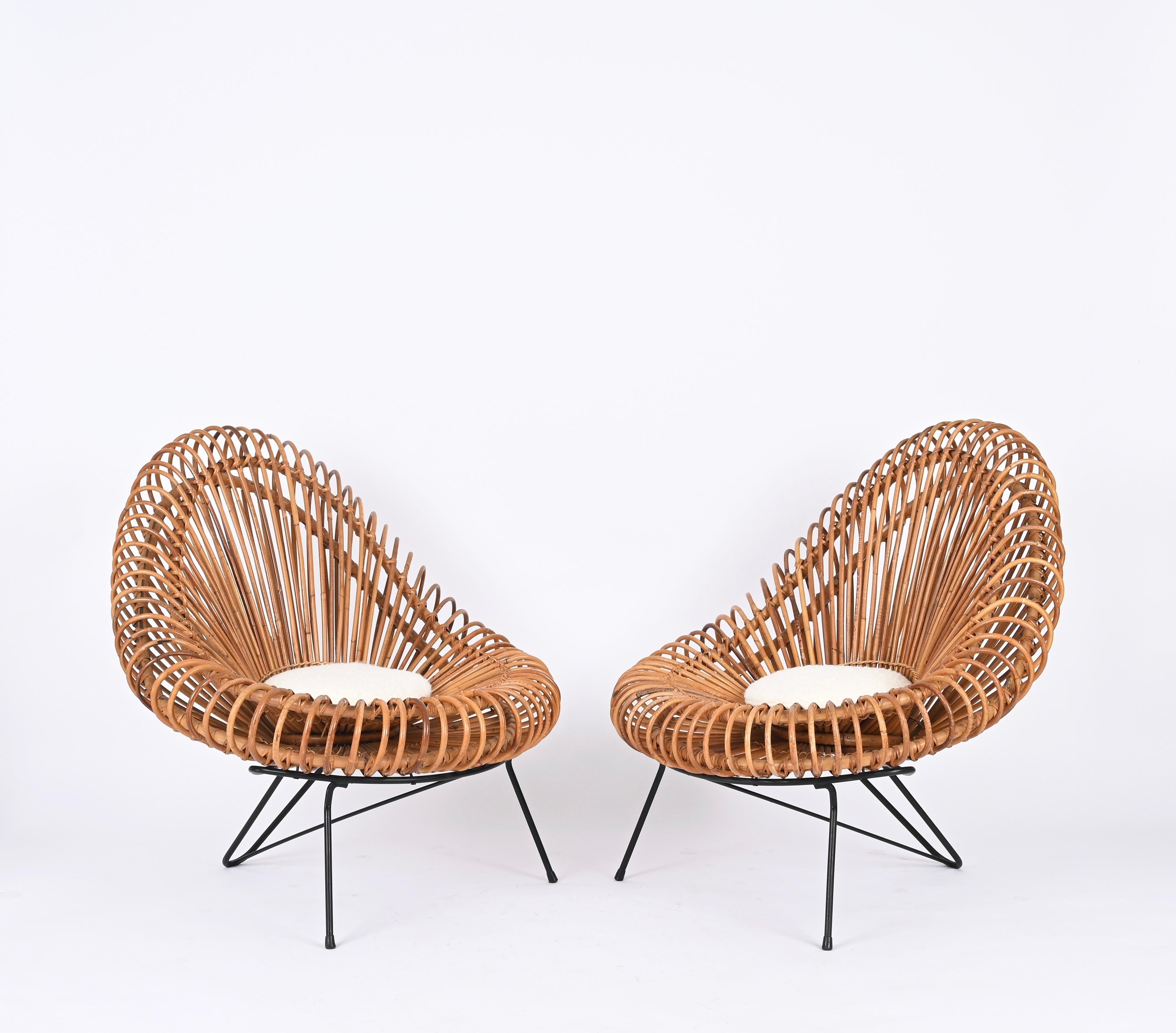 Spectacular pair of lounge chairs designed by Janine Abraham & Dirk Jan Rol and made in France during the late 1950s.

This incredibly rare sculptural rattan chairs are considered the 
