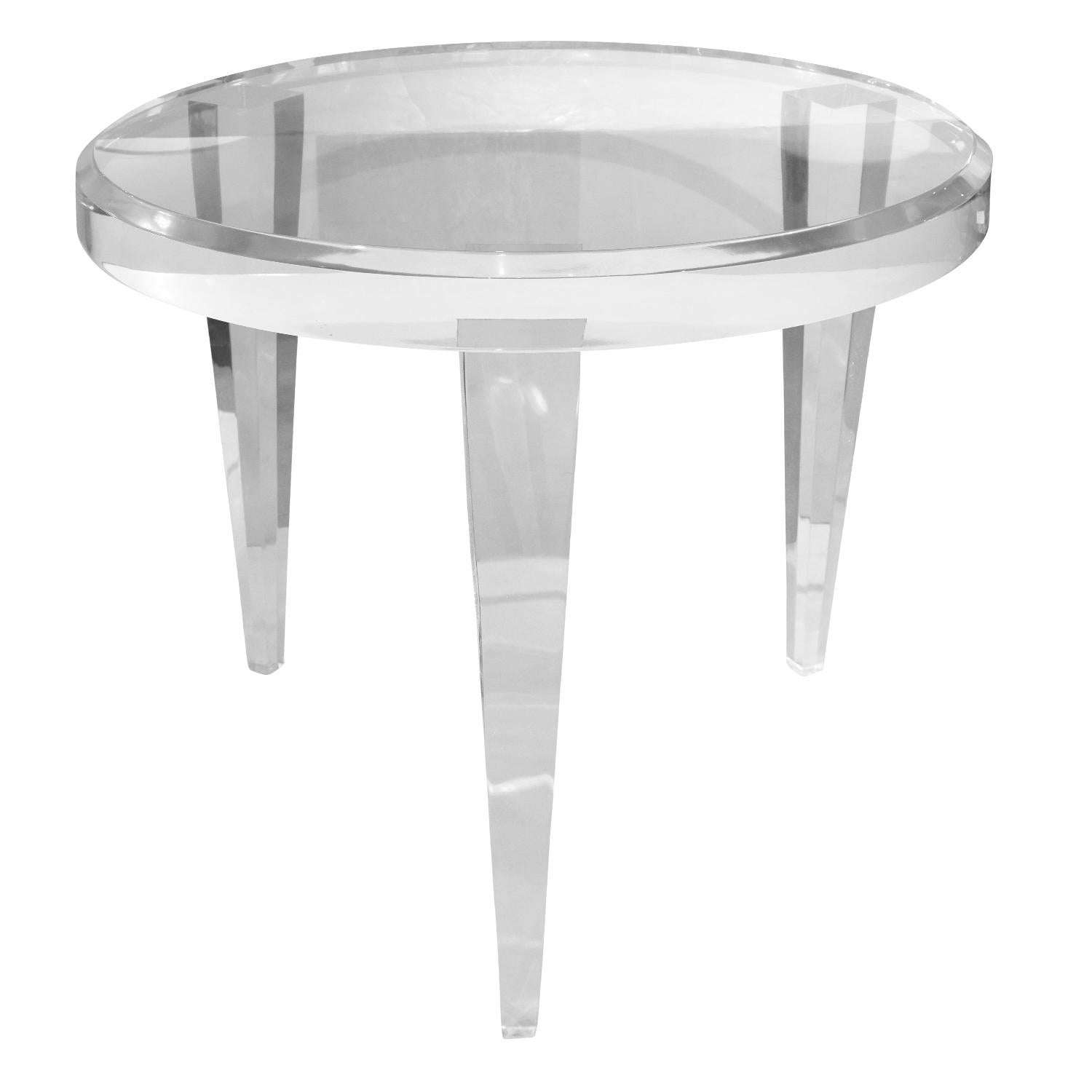 Pair of solid lucite end tables, round with tapering legs, custom design, American 1990's. These were custom made for a NYC apartment. They are beautifully made.