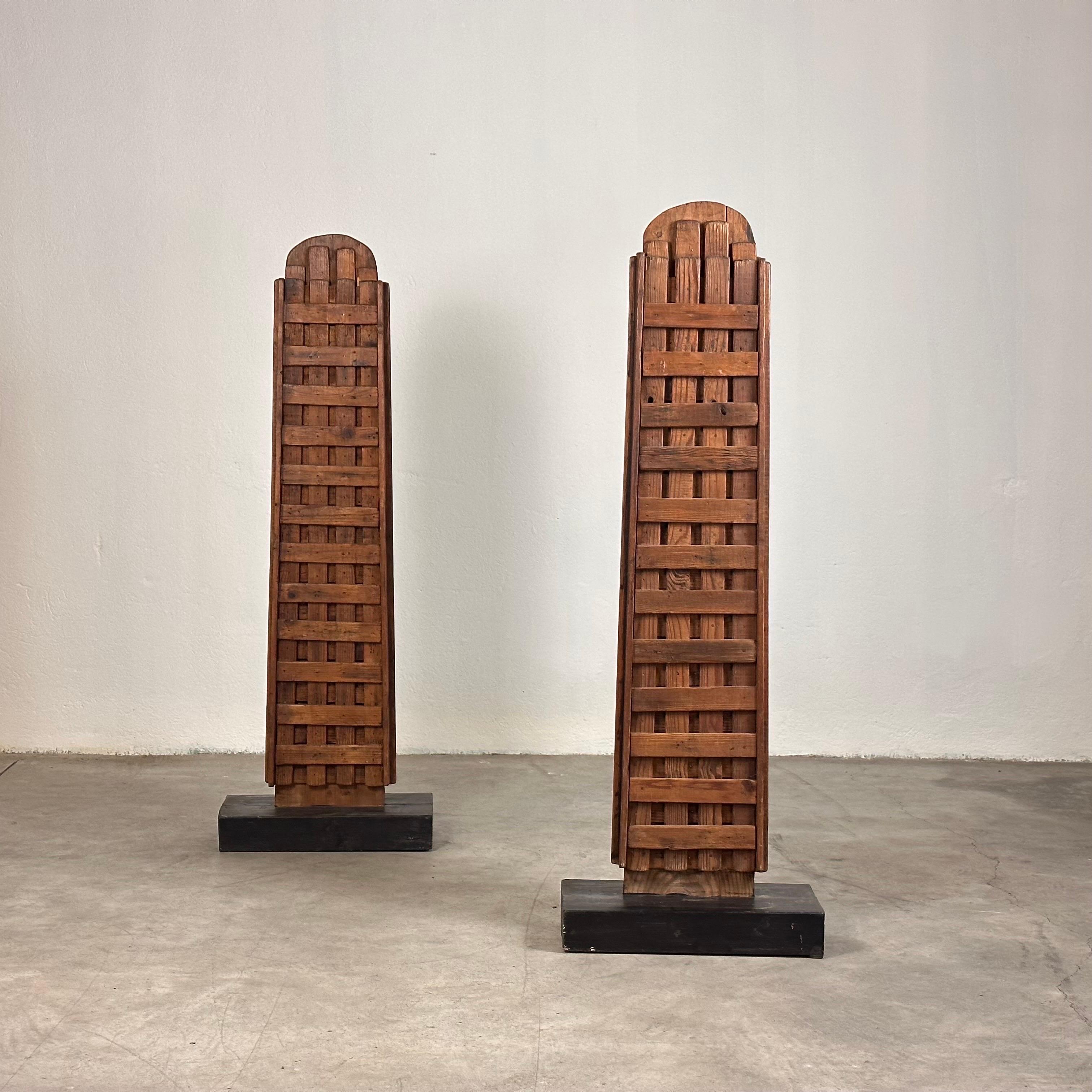 These totem sculptures stand as formidable guardians, reminiscent of ancient sentinels greeting visitors at the entrance to a sacred temple. The rich, warm tones of the walnut wood add a touch of timeless elegance to any interior.

In good vintage