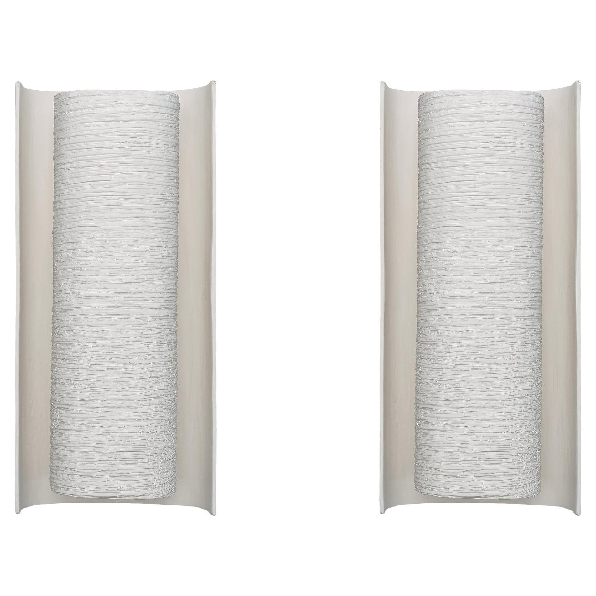 Coppia di sculture in bianco/nero/bronzo Applique in gesso "Galba II