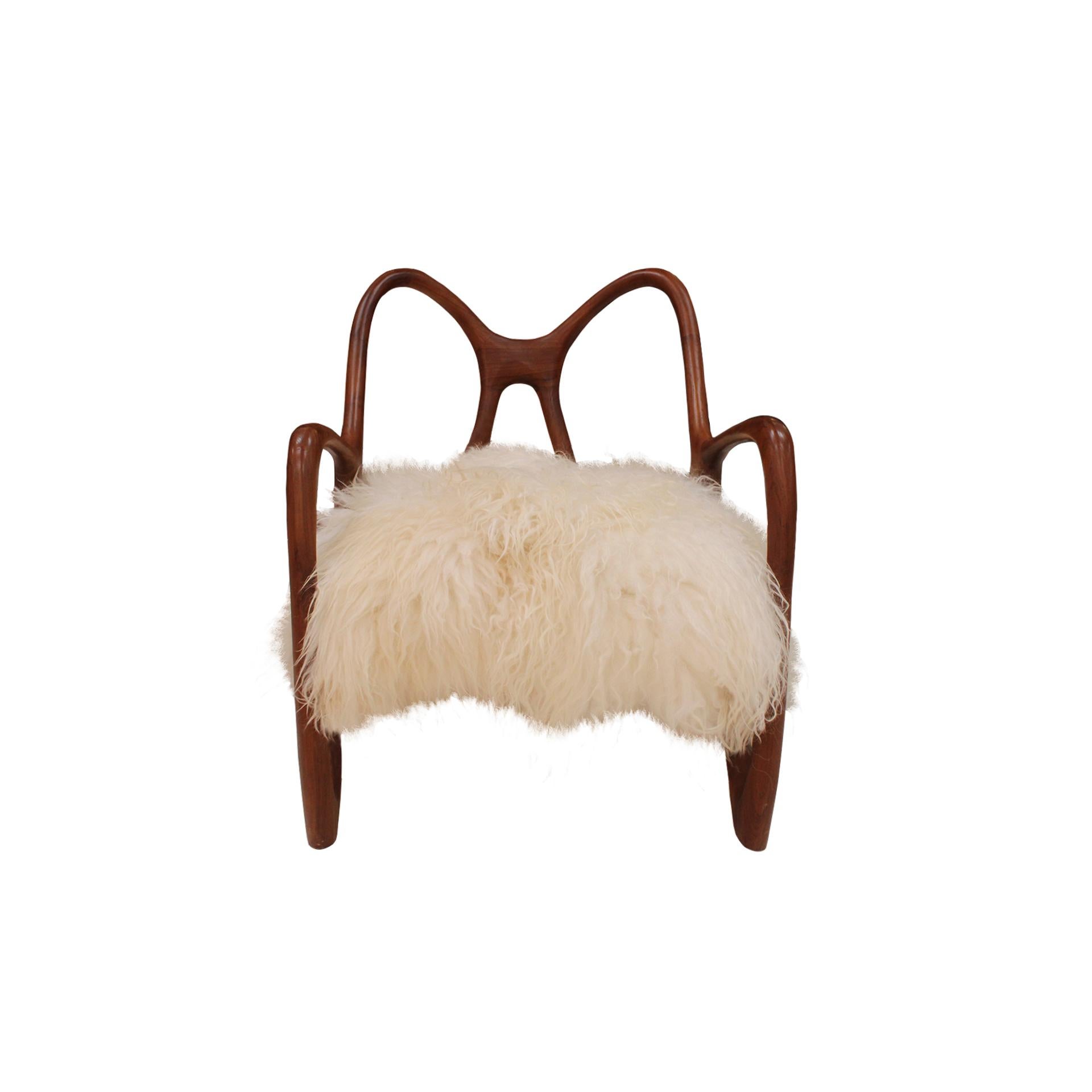 Pair of contemporary armchairs with a sculptural form, inspired by butterfly wings, handcrafted in solid teak wood by cabinetmakers in Italy.

Every item LA Studio offers is checked by our team of 10 craftsmen in our in-house workshop. Special