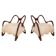 Pareja de sillones escultóricos de madera, Italia