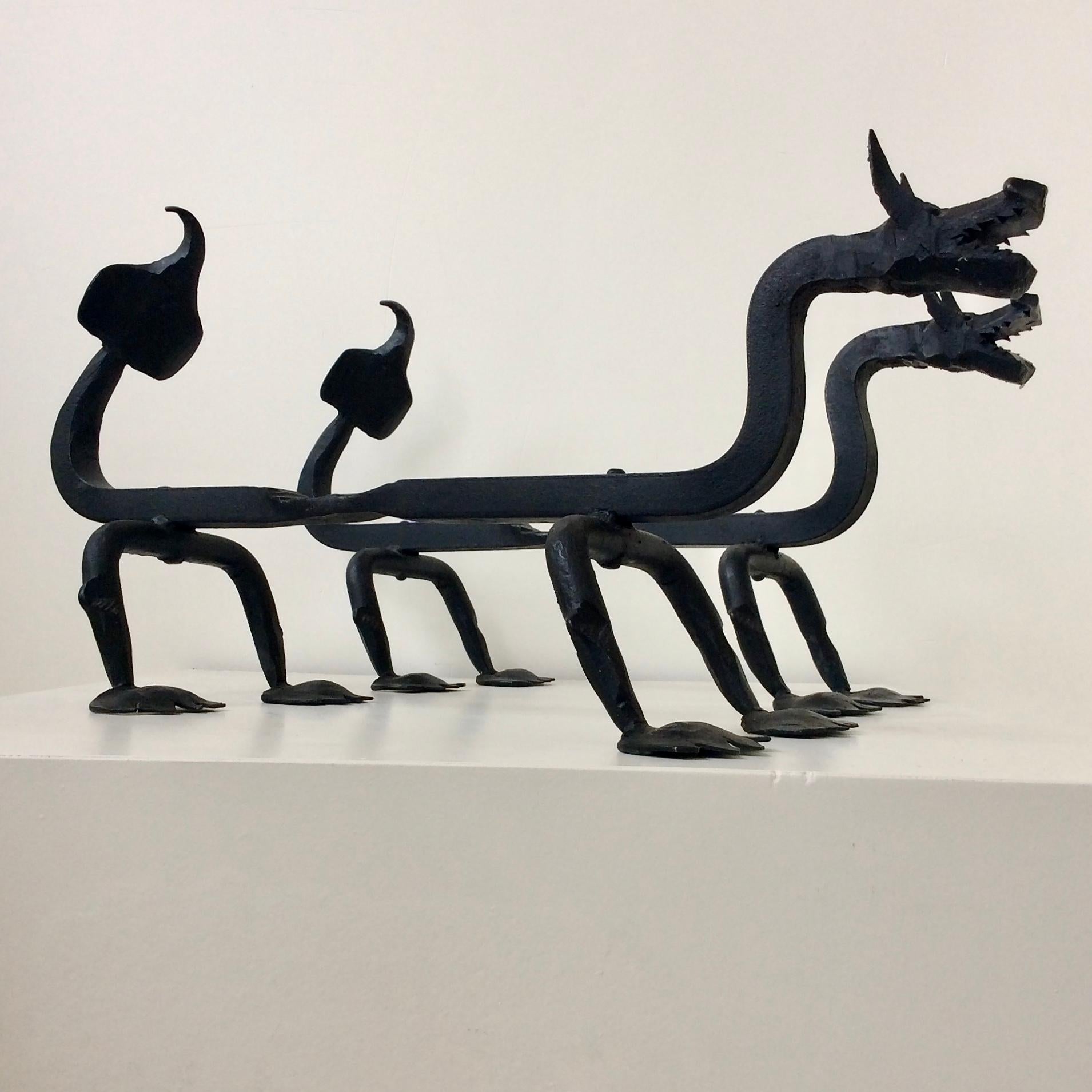 American Sculptural Wrought Iron Pair Of Dragons Andirons, circa 1910.