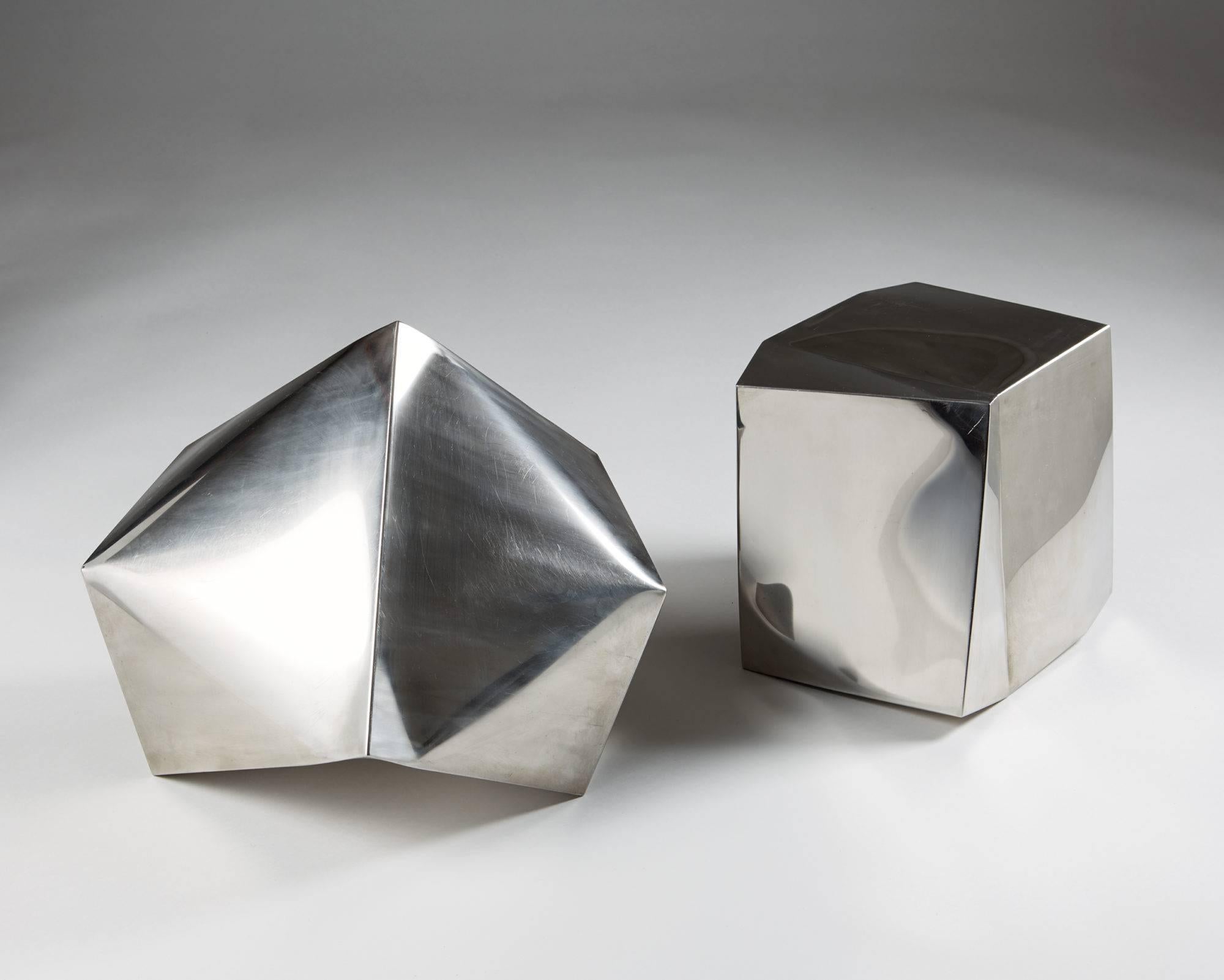 Pair of sculptures untitled by Ib Agger, 
Denmark, 2006.

Polished steel.

Provenance: Galleri DGV, Svendborg, Denmark.

Measures: Height of the smaller 31 cm/ 12 1/4''
Height of the larger 34 cm/ 13 1/2''.