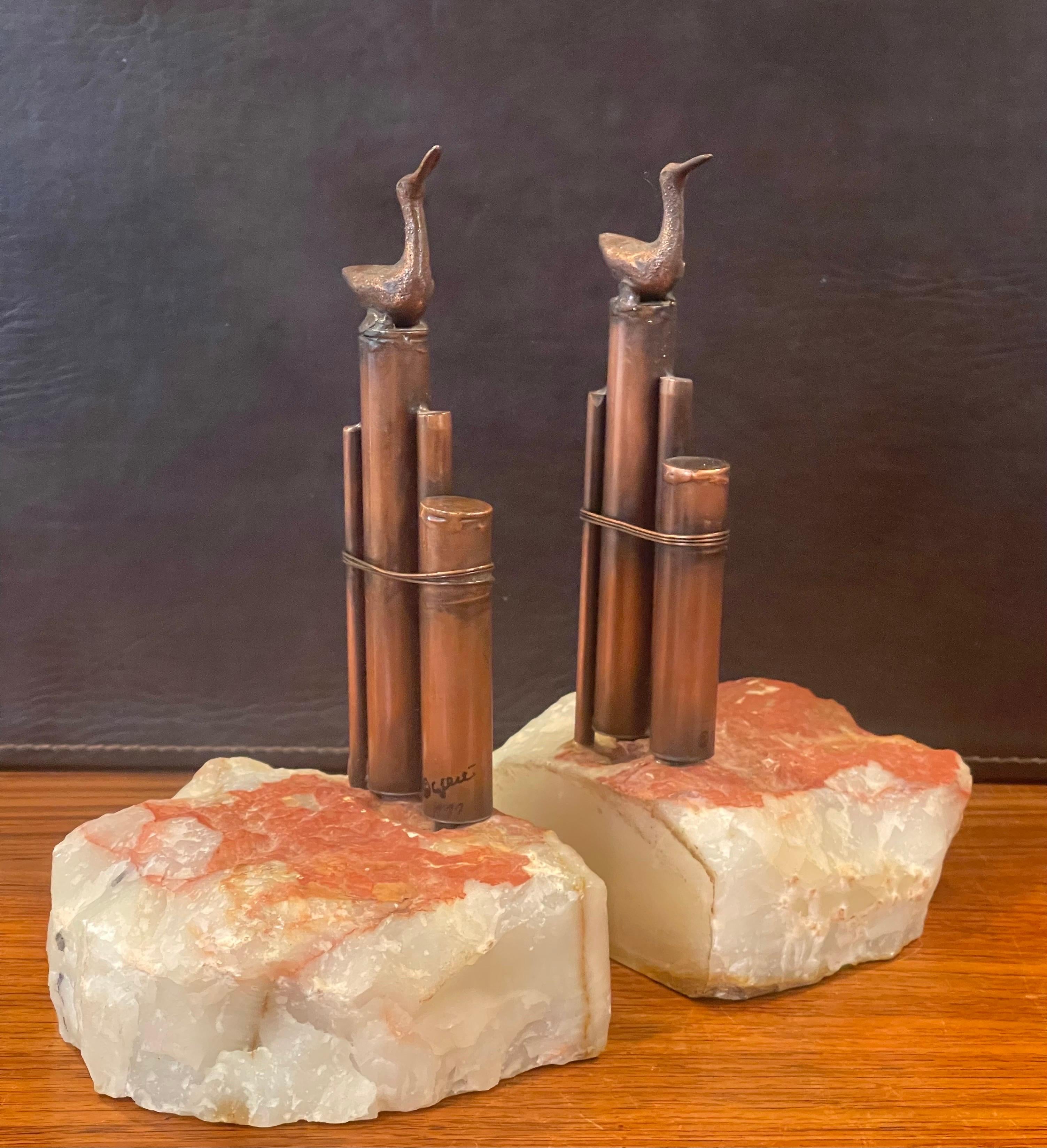 Excellent and rare pair of sea birds on ocean pylon bookends by Curtis Jere for Artisan House, circa 1977. The pair are signed and dated and are in very good vintage condition with a wonderful patina. They measure 9