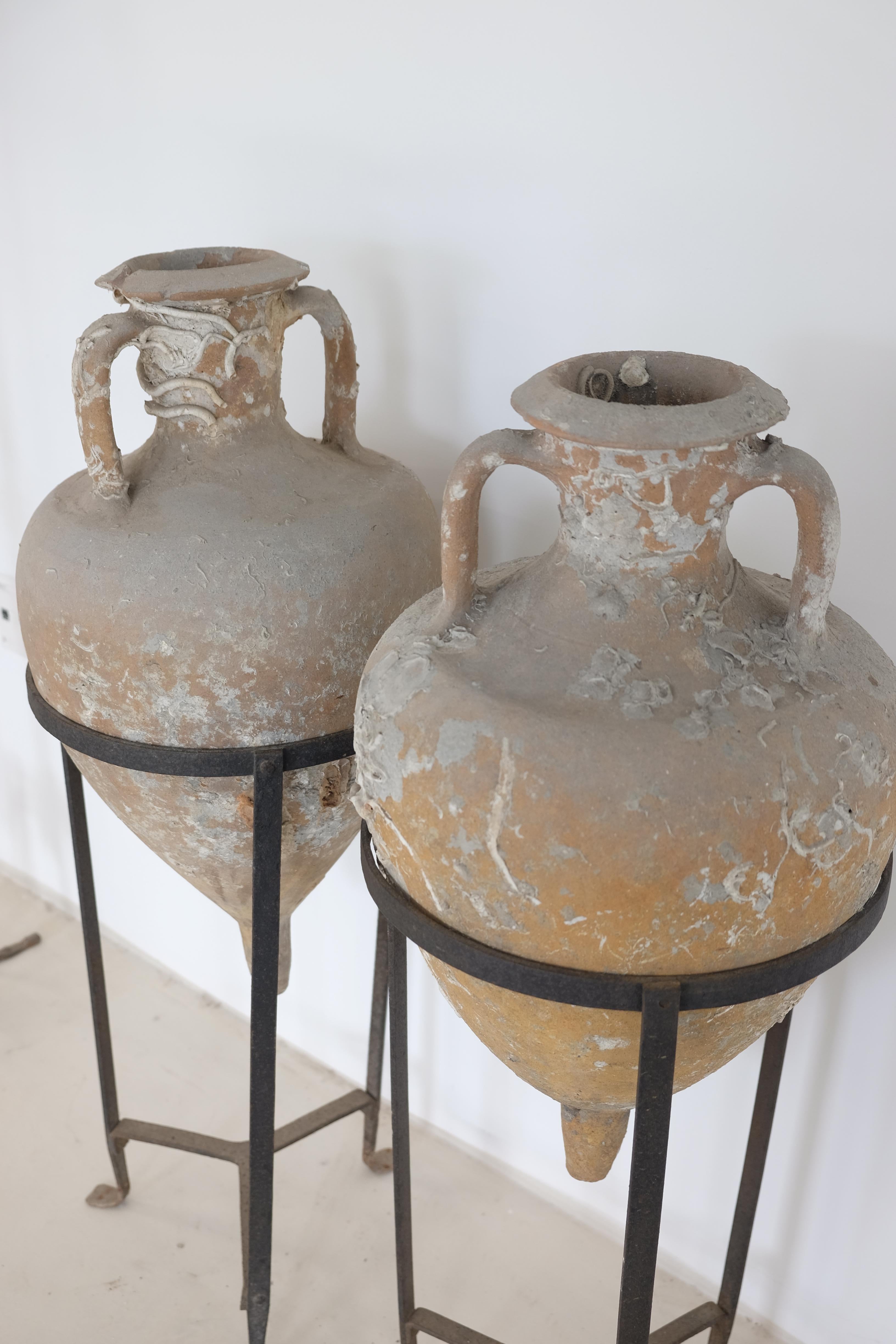Classical Roman Pair of Sea Salvaged Roman Amphorae with 19th Century Wrought Iron Stands