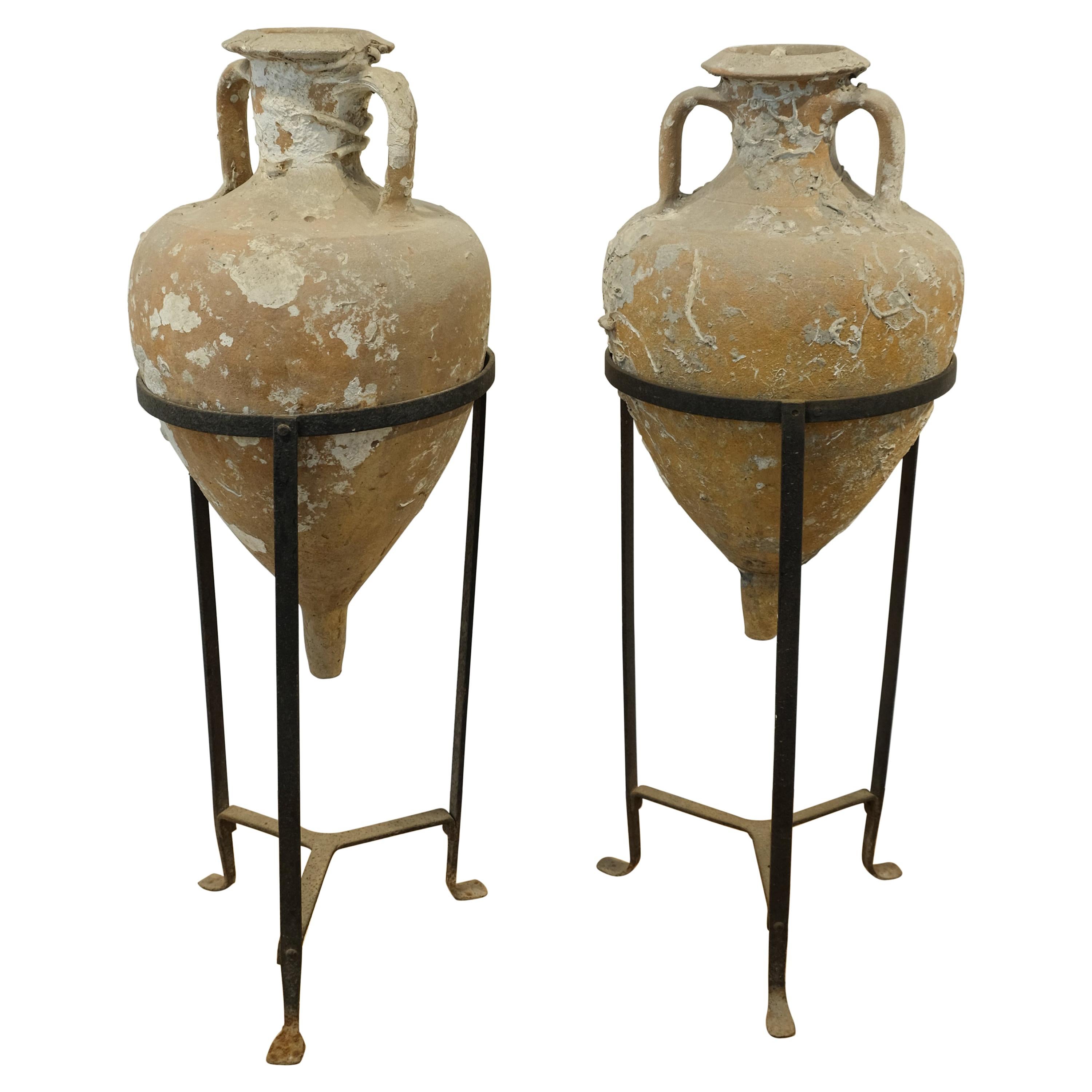 Pair of Sea Salvaged Roman Amphorae with 19th Century Wrought Iron Stands