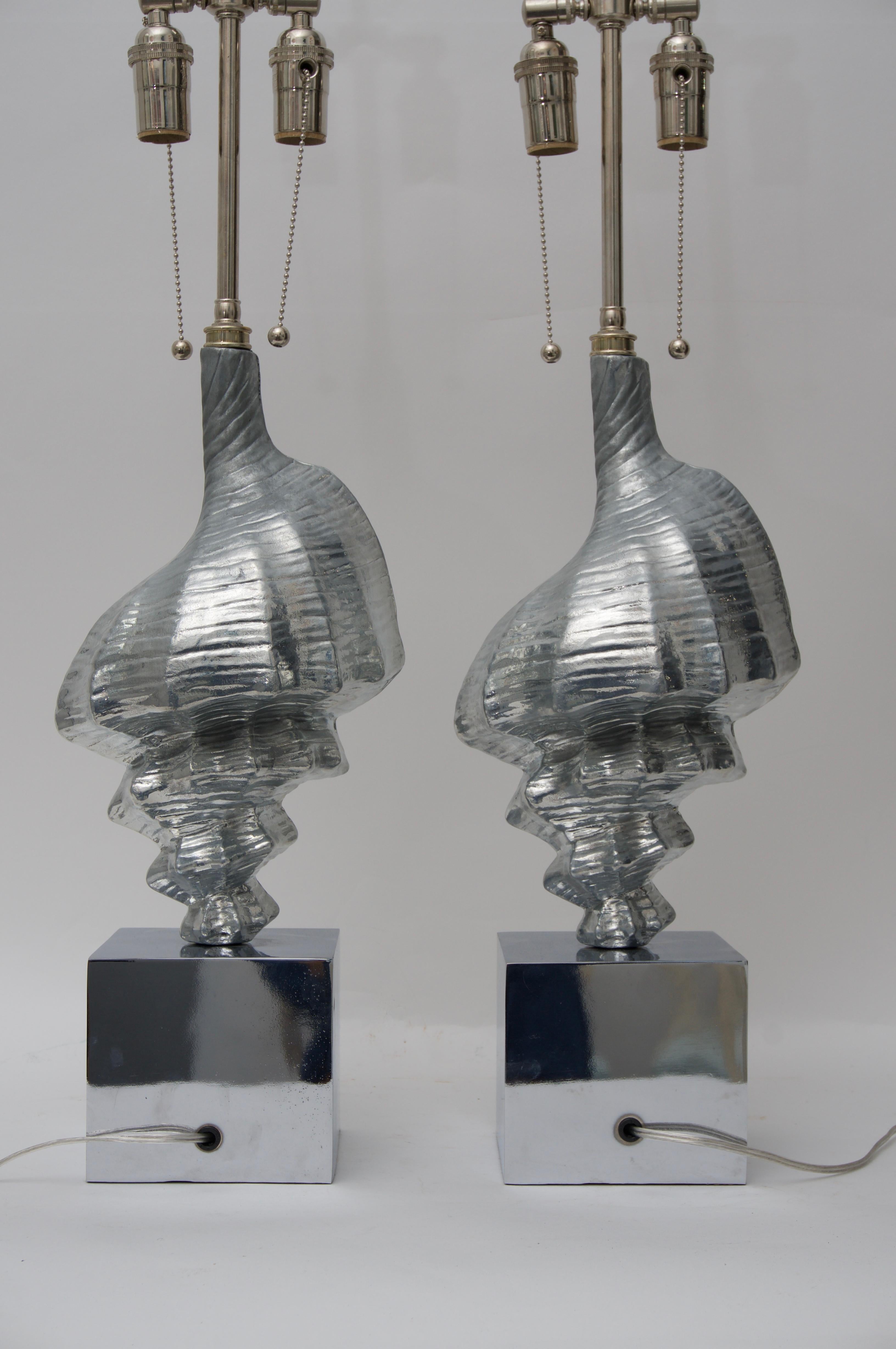 This stylish pair of seashell-form table lamps are very much in the style and quality of pieces created by Arthur Court.