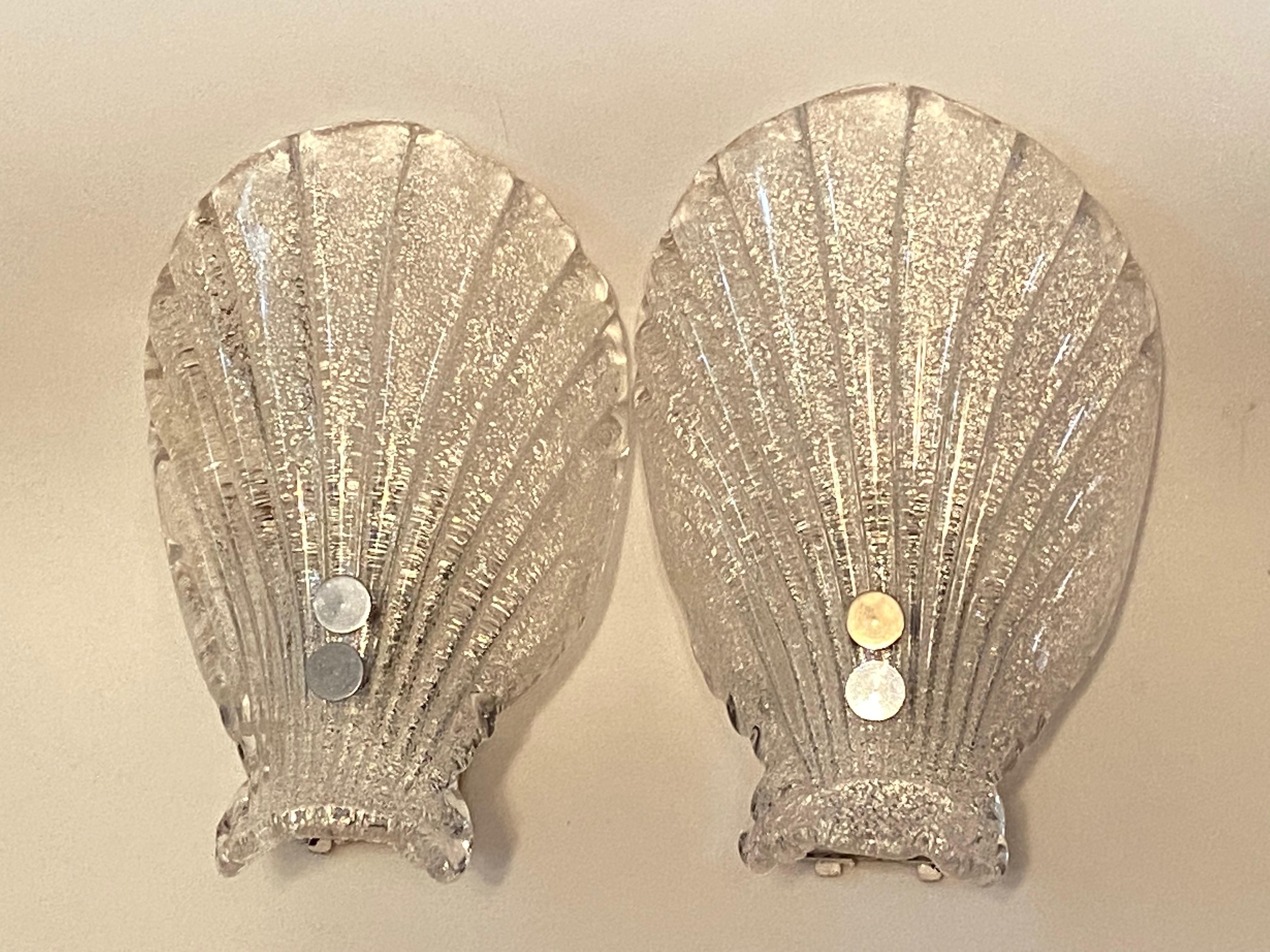 Pair of sea shell form wall lights, produced in Germany by Soelken Leuchten, in textured glass, affixed against a chrome base, circa 1960s. The glass shades probably made in Murano Italy and chrome base made in Germany. An iconic design from the