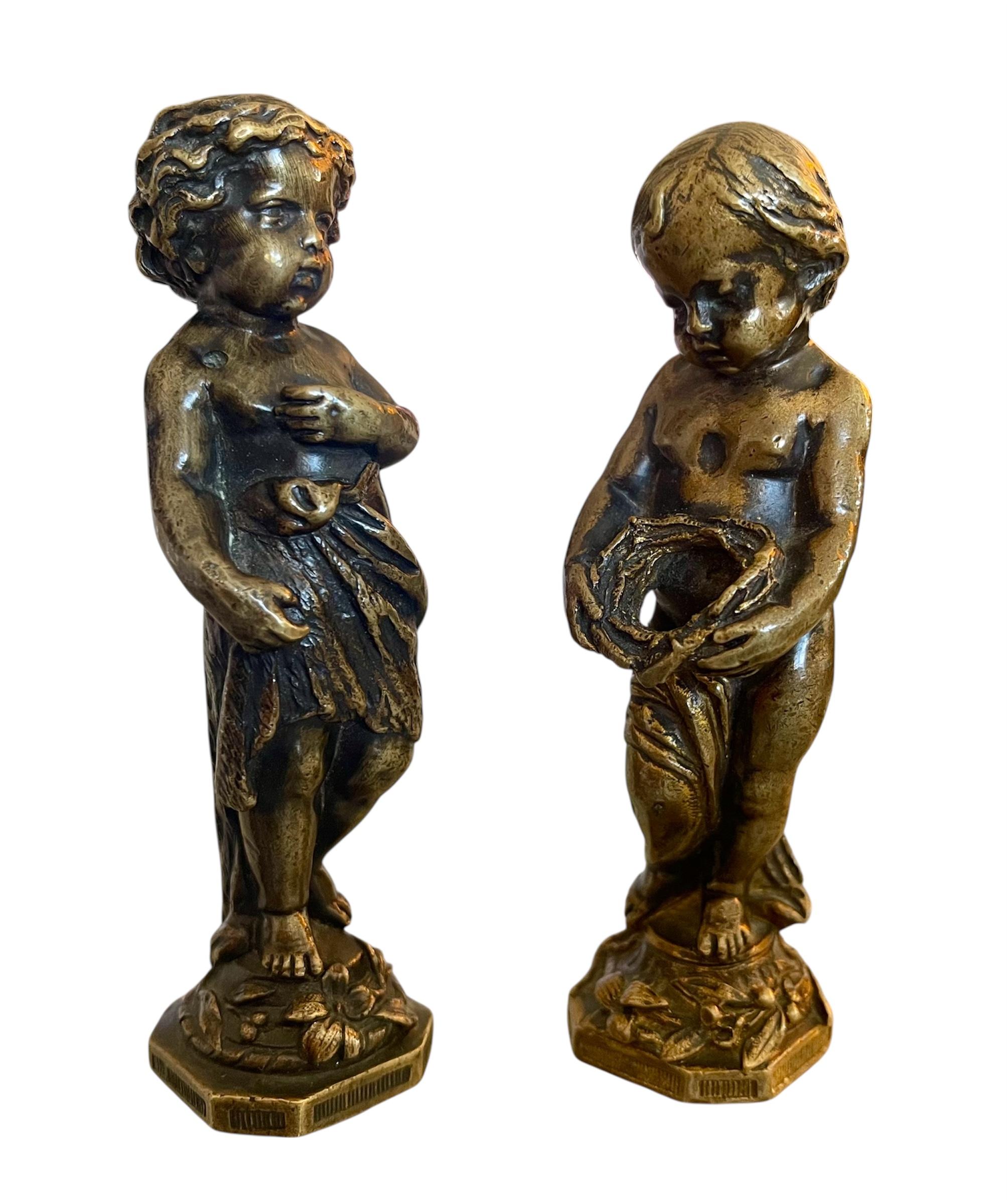 A rare pair of bronze seals, one depicting a child with a bird and the other a child with an empty nest. These casts were made after sculptures by Jean-Baptiste Pigalle (1714-1785). The seals are unmarked and therefore do not bear initials. These