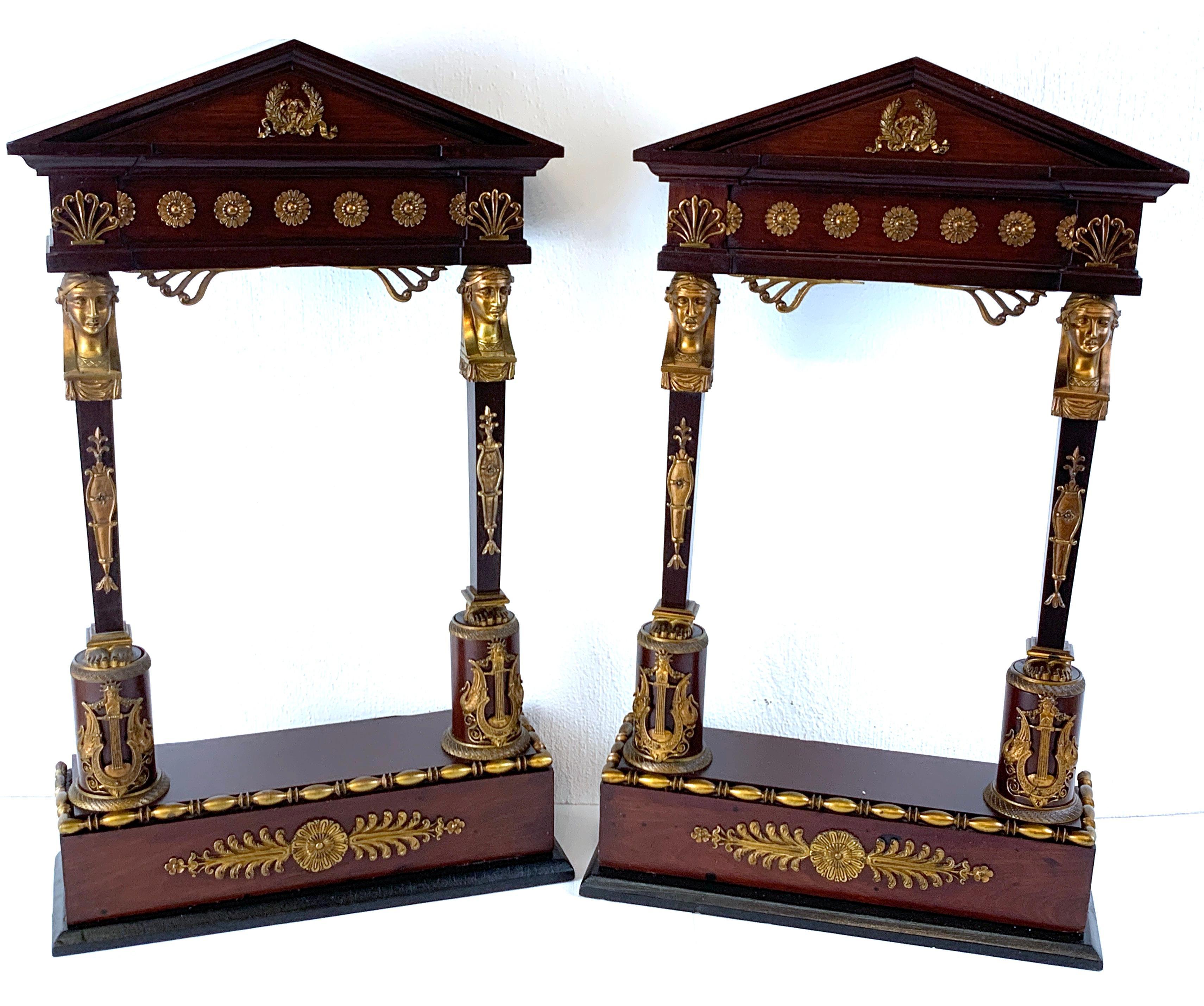 A pair of second Empire Caryatid wall ormolu mounted wall shelves, each one with arched pediment, with caryatid columns, resting on a plinth with a display surface of 6.5”wide x 3”deep x 12.25” high.
 