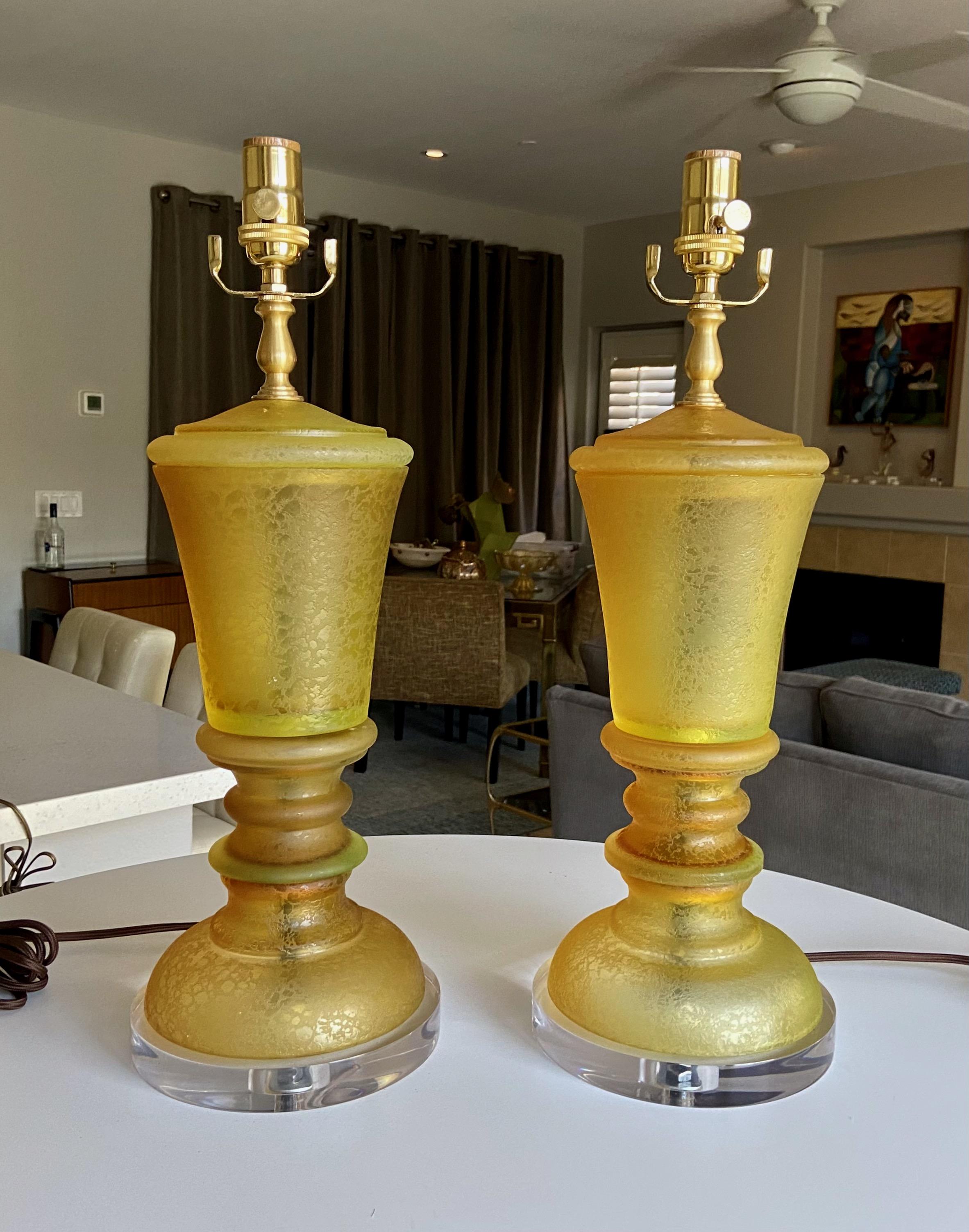 Pair of Seguso handblown Italian Murano glass tables lamps on new acrylic bases. The color is varying shades of amber and yellow and glass is in the Corroso technique. Newly wired for US with new brass fittings, 3-way sockets and rayon covered