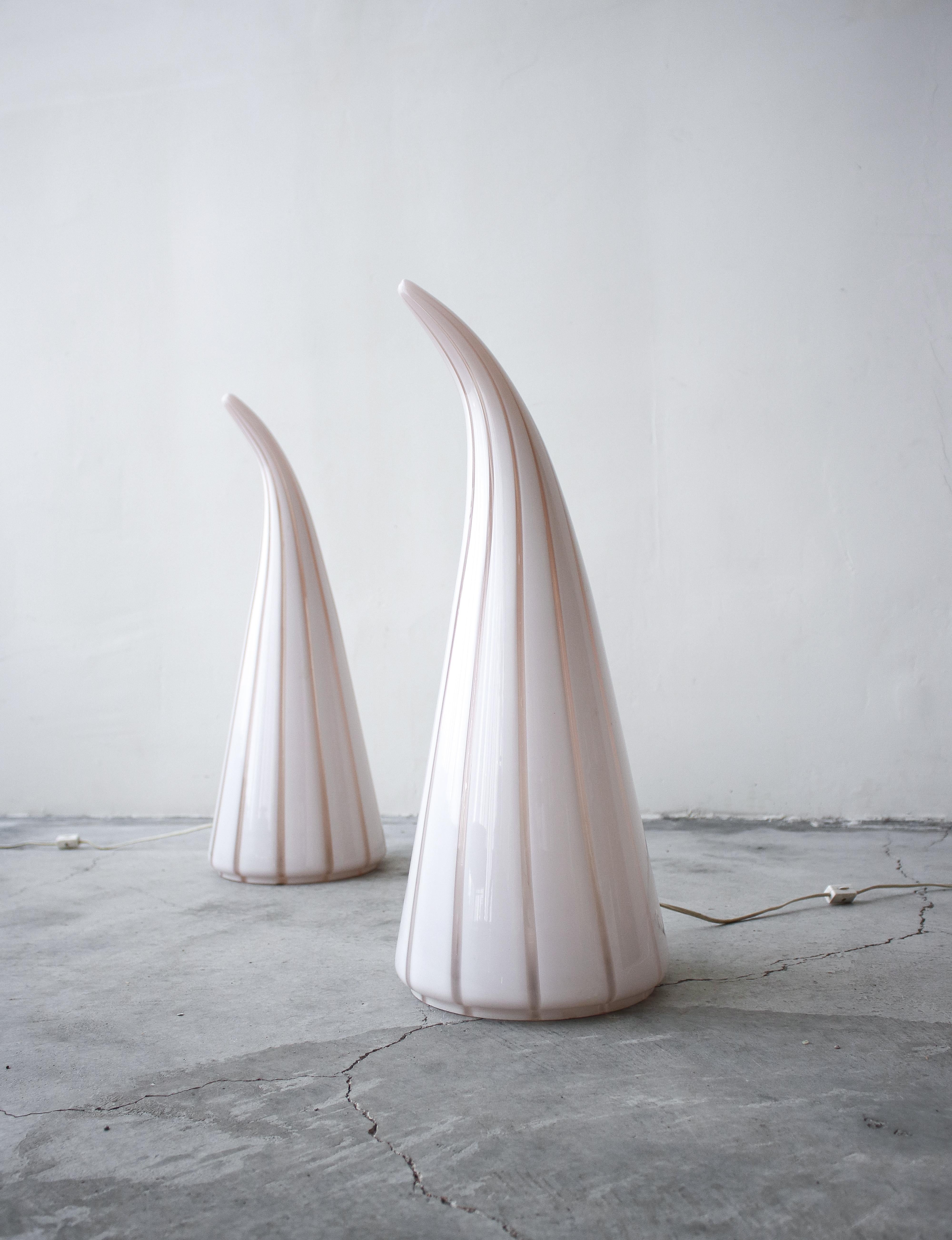 Stunning pair of blown glass Horn table lamps by Seguso Vetri d'Arte. Lamps are a sophisticated Horn shape with milky white and a transparent pale pink swirl. They give off the warmest glow when on, the perfect mood light.

Lamps are in excellent