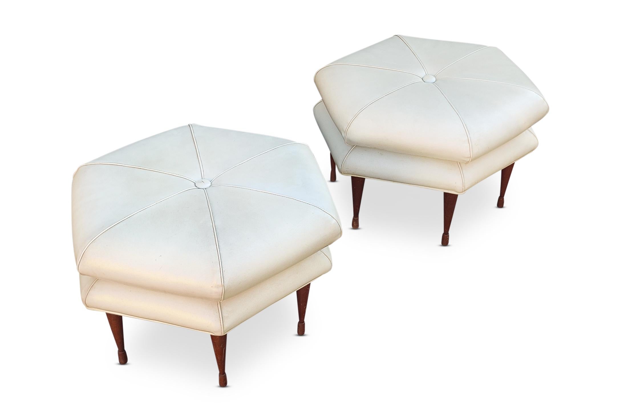 In the Mid-Century Modern style of Edward Wormley, or so many of the other greats from the 1960s design era, these hexagonal form benches, ottomans, stools, are time capsule gems! Covered in the original vinyl leatherette, atop turned walnut legs.