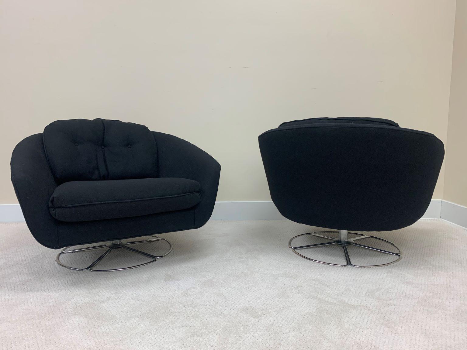 Beautiful pair of vintage 1970s chrome base lounge chairs by Selig. Both chairs retain the original Selig manufacturing labels. In addition to the labels, a shipping document with an additional fabric sample is attached. Chairs are currently