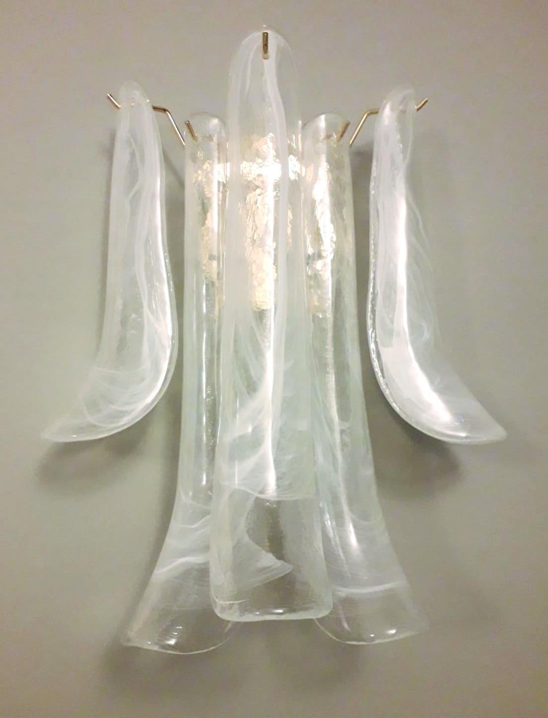 Pair of Italian wall lights with vintage clear and light milky white Murano banana glass petals mounted on newly made gold finish metal frames / Made in Italy
Measures: height 16.5 inches, width 13.5 inches, depth 8 inches
2 lights / E12 or E14