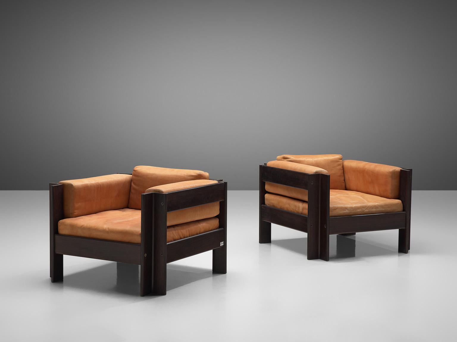 Sergio Asti for Poltronova, 'Zelda' lounge chairs, leather, darkened wood, Italy, 1962.

Beautiful lounge chairs designed by Sergio Asti for Poltronova. These chairs are made with a dark wooden frame and terracotta/cognac colored leather cushions.