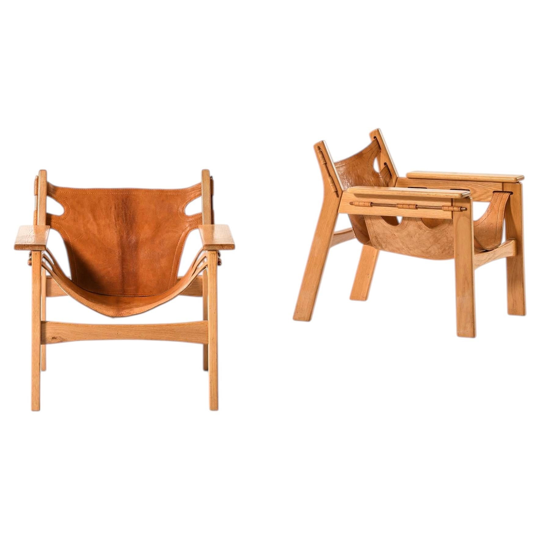 Coppia di poltroncine di Sergio Rodrigues in Oak e pelle di Oca, anni '70