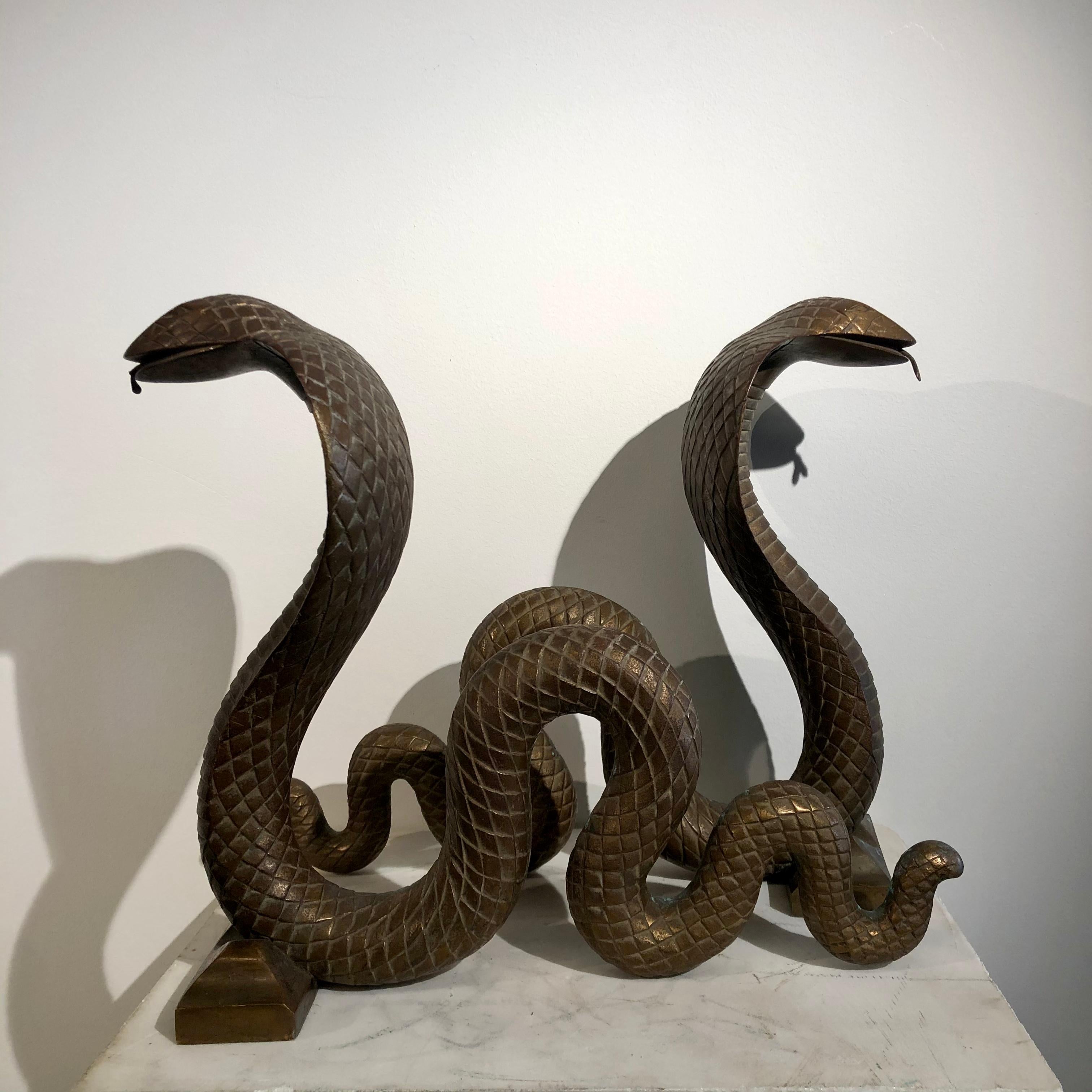 Pair of serpent andirons in bronze with gold patina attributed to Edgar Brandt (French, 1880-1960)
Created circa 1924.
 