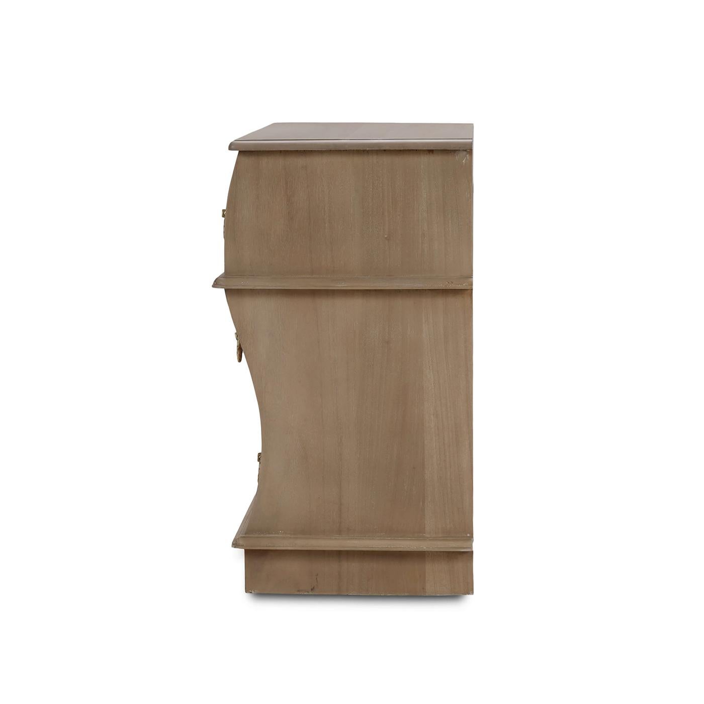 Crafted from solid mahogany and finished in a serene sandbar finish, these nightstands feature an elegant serpentine front that adds a touch of refined charm to any bedroom.

The gentle curves and smooth finish effortlessly complement both