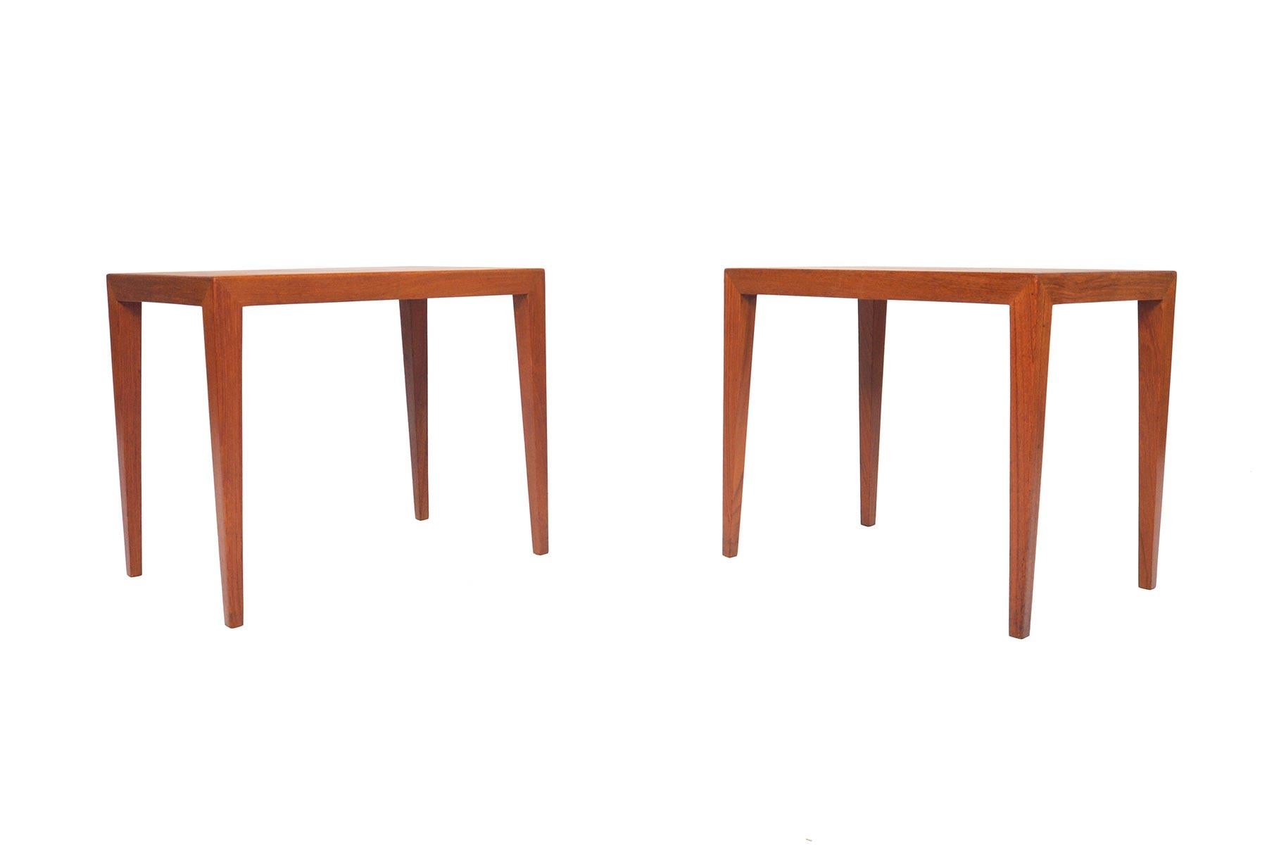 This pair of Danish modern teak side tables was designed by Severin Hansen for Haslev Møbelsnedkeri in the early 1960s. Underneath the refined, handsome lines of these tables lies an extremely high level of skilled craftsmanship, which can be seen
