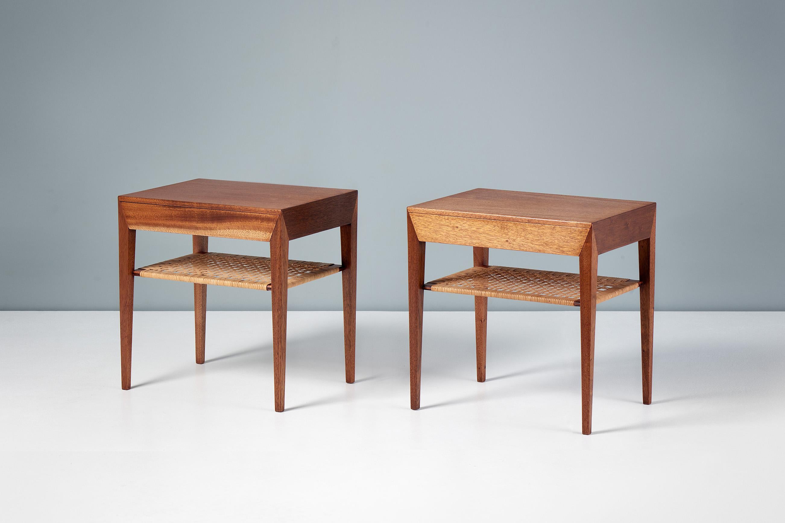 Severin Hansen - Pair of Mahogany Nightstands, c1950s.

Pair of bedside tables with single, birch-lined slim drawers and original woven rattan cane shelves below. Produced by Haslev Mobelsnedkeri, Denmark in rich African mahogany veneer with solid