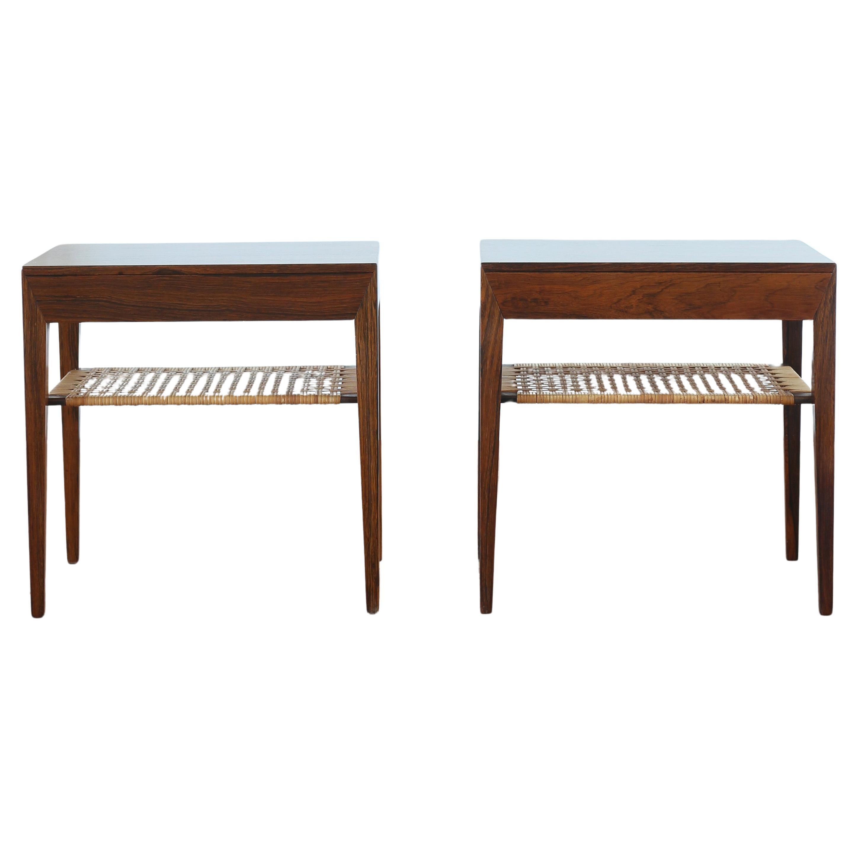 A pair of Severin Hansen side tables in rosewood with cane shelf and drawer. Designed by Severin Hansen 1960s and made at Haslev møbelsnedkeri in Denmark. 
Very fine condition.
Marked by maker. 