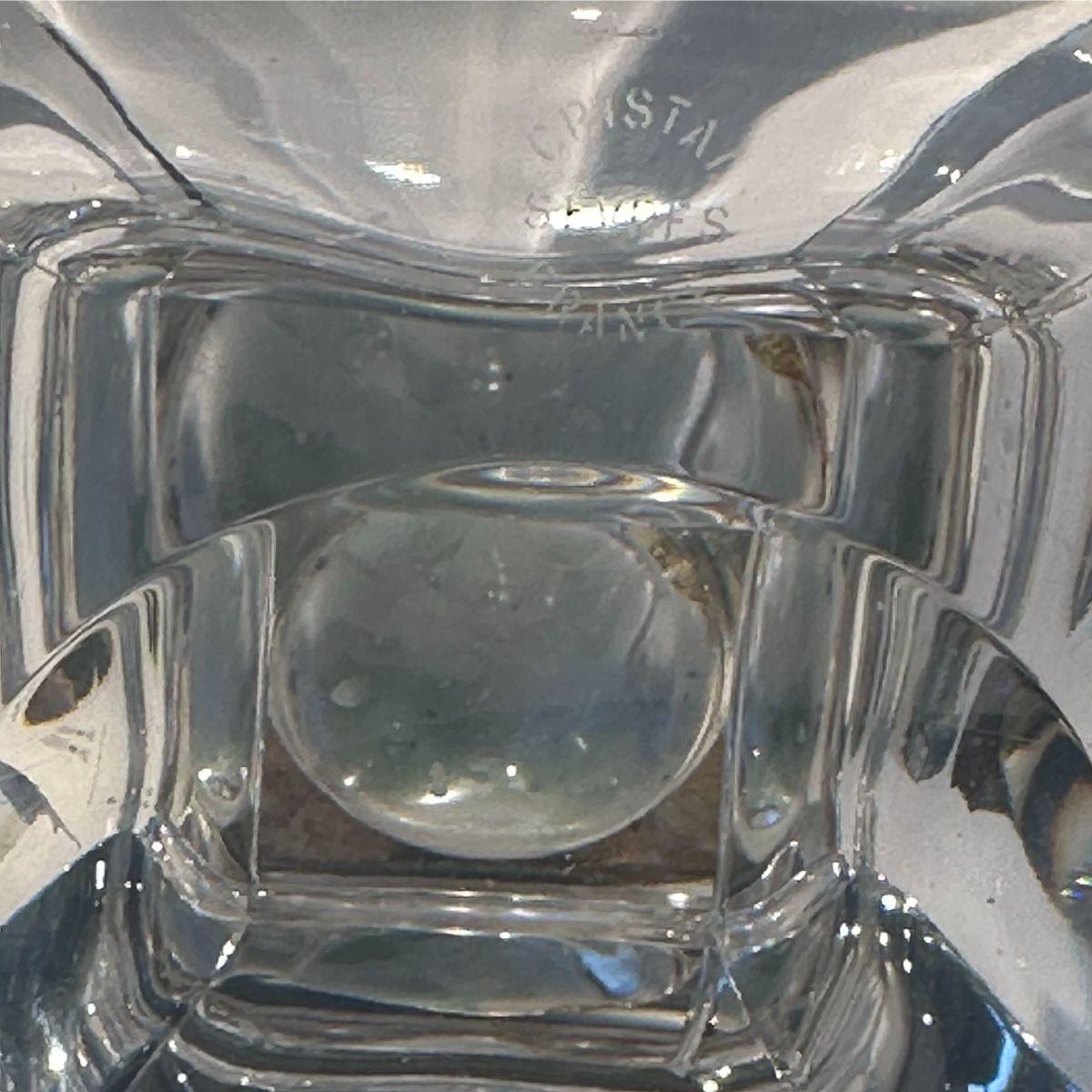 Pair of French Sèvres crystal glass hurricanes, combining elements of Art Deco and Art Nouveau design.
Each hurricane features a tall, engraved dome decorated with oak leaves, acorns, and cornflowers. A silver-plated metal ring connects the dome to