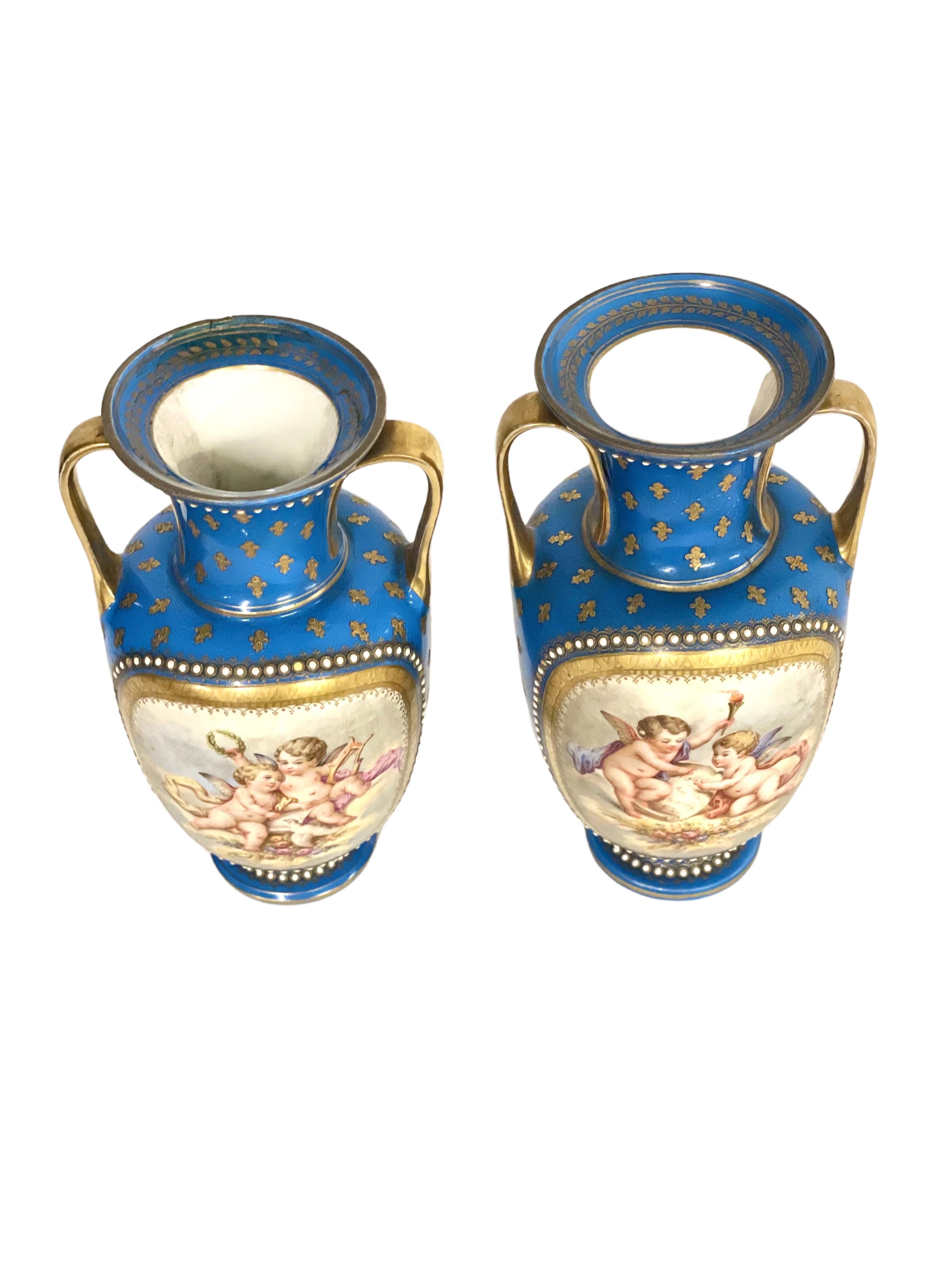Charles X Sèvres Pair of Gilded and Blue Porcelain Vases, 19th Century