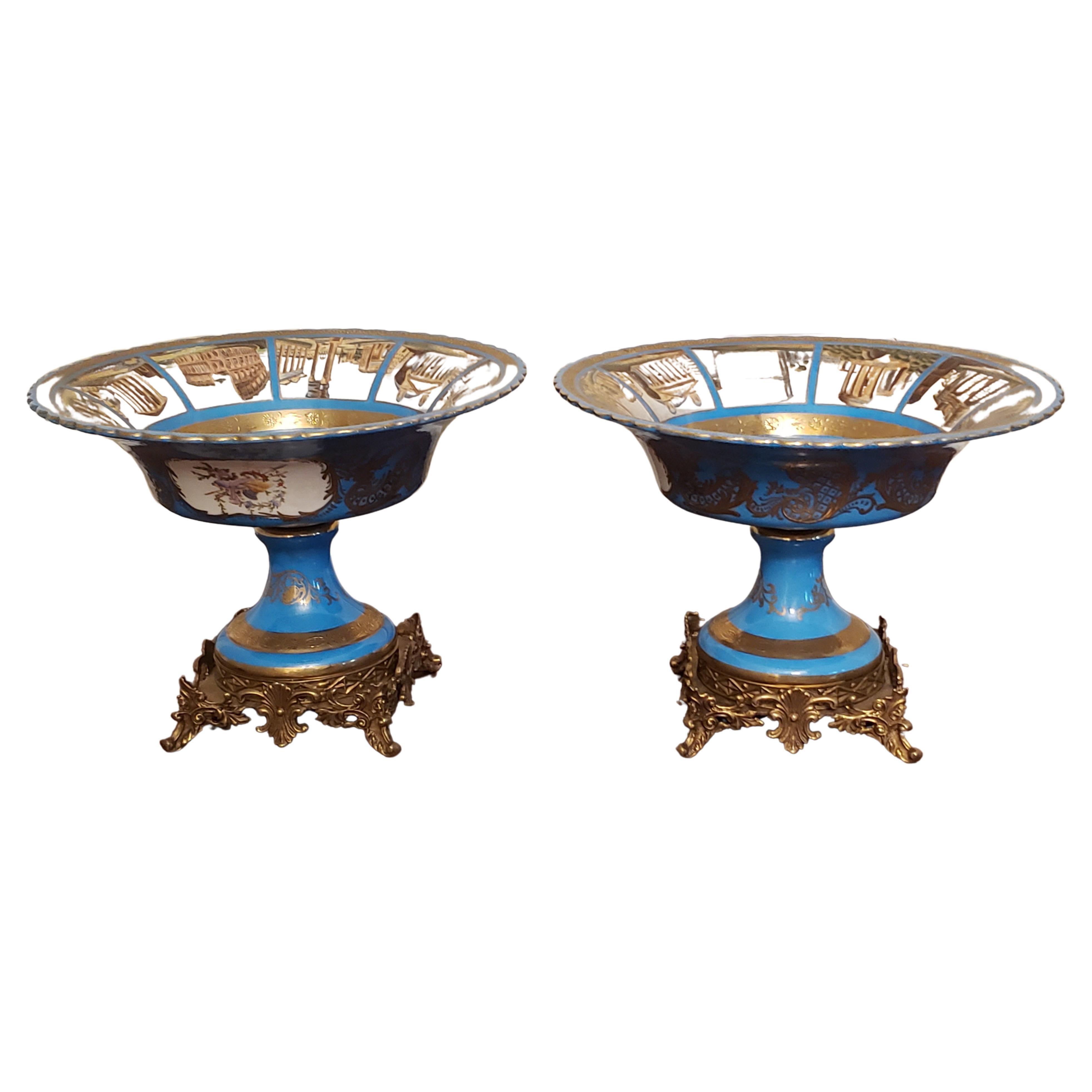 Pair of Sevres Patinated Metal Mounted Blue Celeste Type Roman Painted Ceramic Compotes. 
Very good antique condition. Intricate painting work. inside painting depicts an amazing representation of the St Peter Square in Rome at the center, and