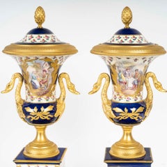 Pair of Sèvres Porcelain and Gilt Bronze Cassolettes in the Empire Style.