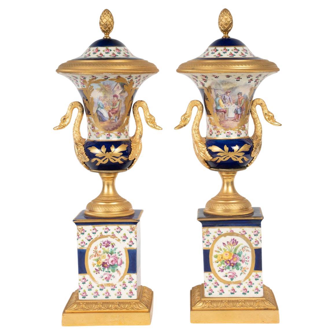 Coppia di cassette di Sèvres in porcellana e bronzo dorato in stile Impero.