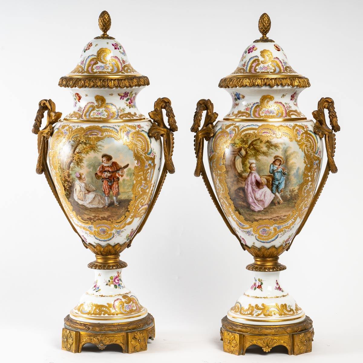 Pair of Sèvres porcelain covered vases, white background and rich decoration, very nice chasing of the bronze with its original gilding, 19th century, Napoleon III period, very good condition, great decoration.
H: 56 cm, W: 27 cm, D: 20 cm
ref 3009