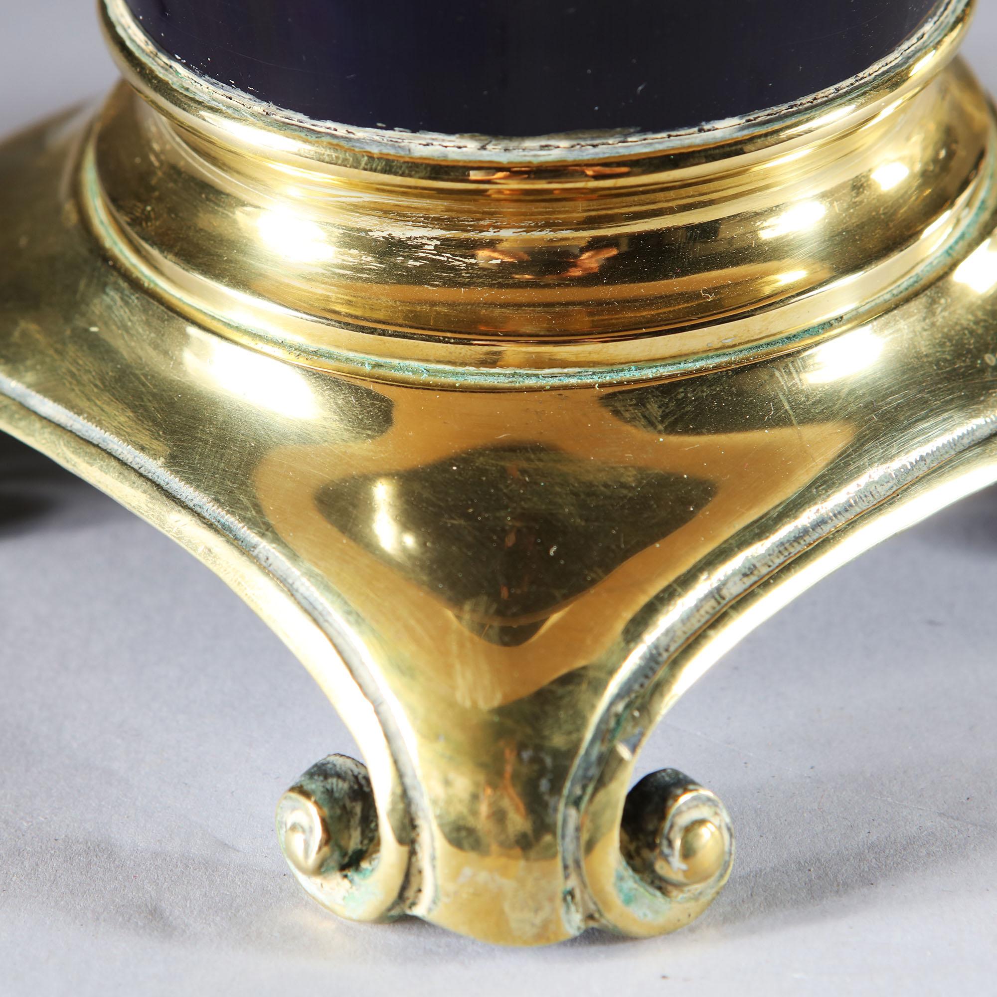 A fine pair of dark blue Sèvres porcelain oil lamps with brass mounts, now converted to electricity.

Currently wired for the UK. Please enquire for rewiring services.

Please note: Lampshades not included.