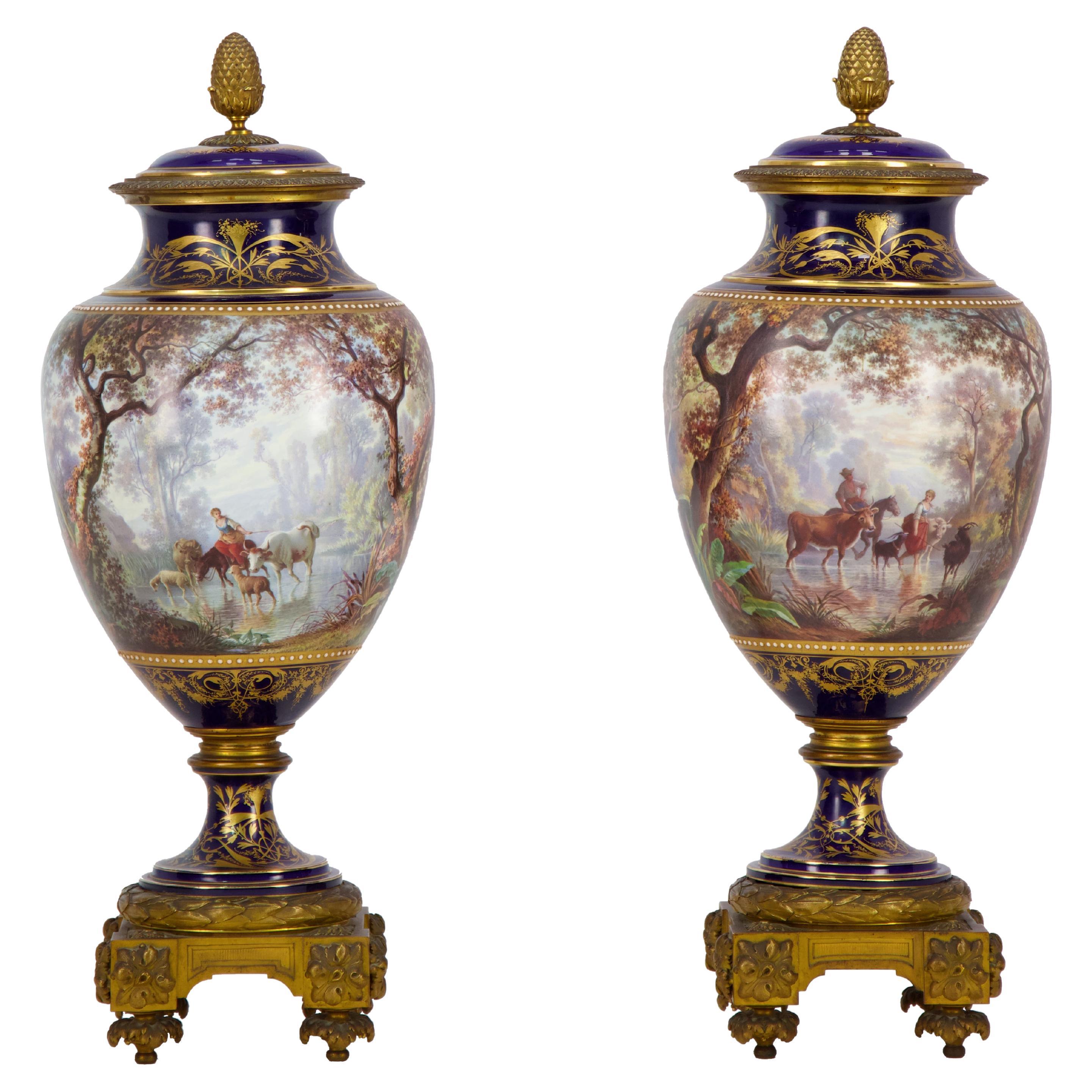 Pair of Sèvres porcelain vases mounted in gilt bronze painted by J. Machereau For Sale