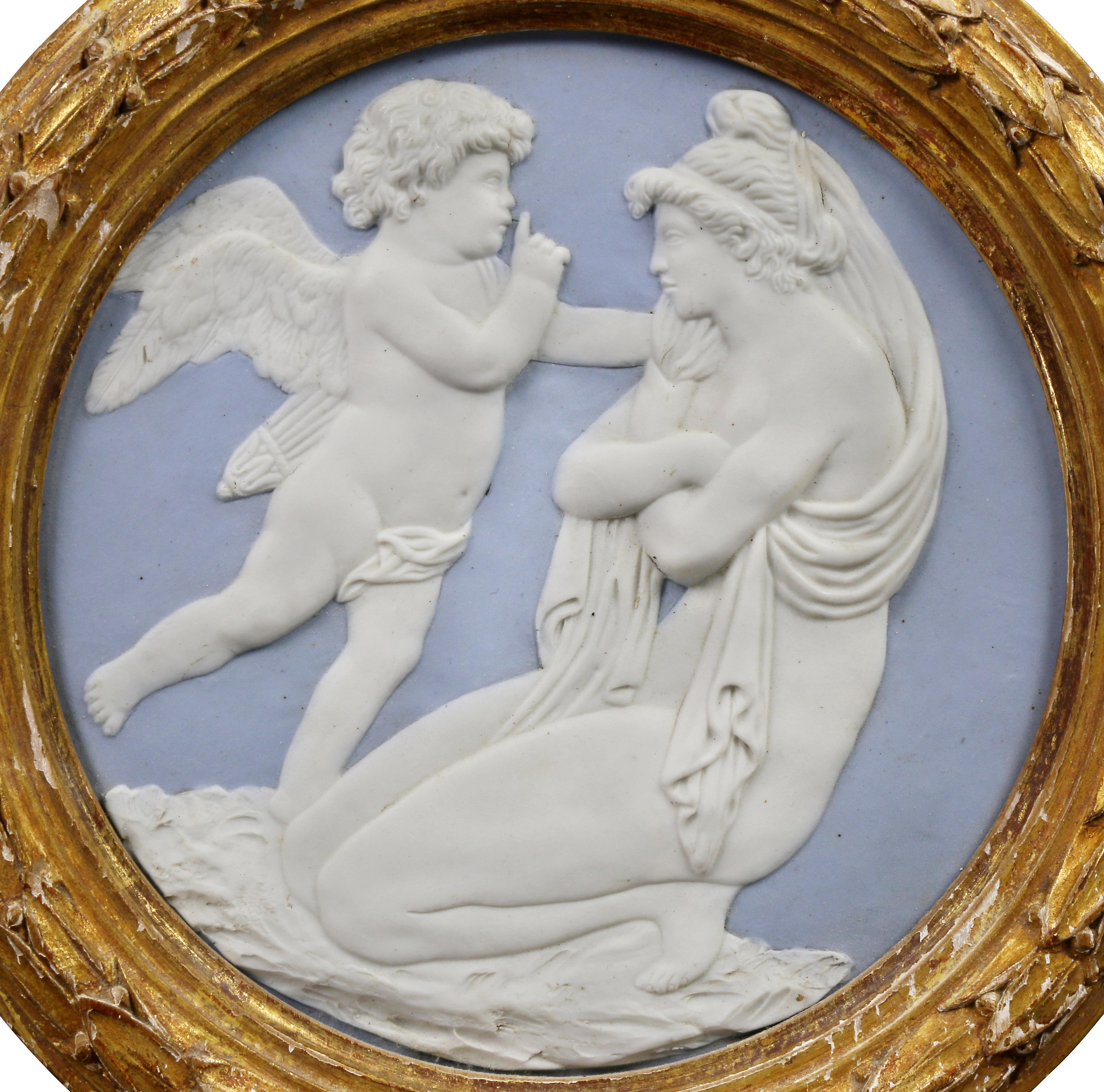 Circular in giltwood frames, each with lavender background and relief of Cupid and Psyche.