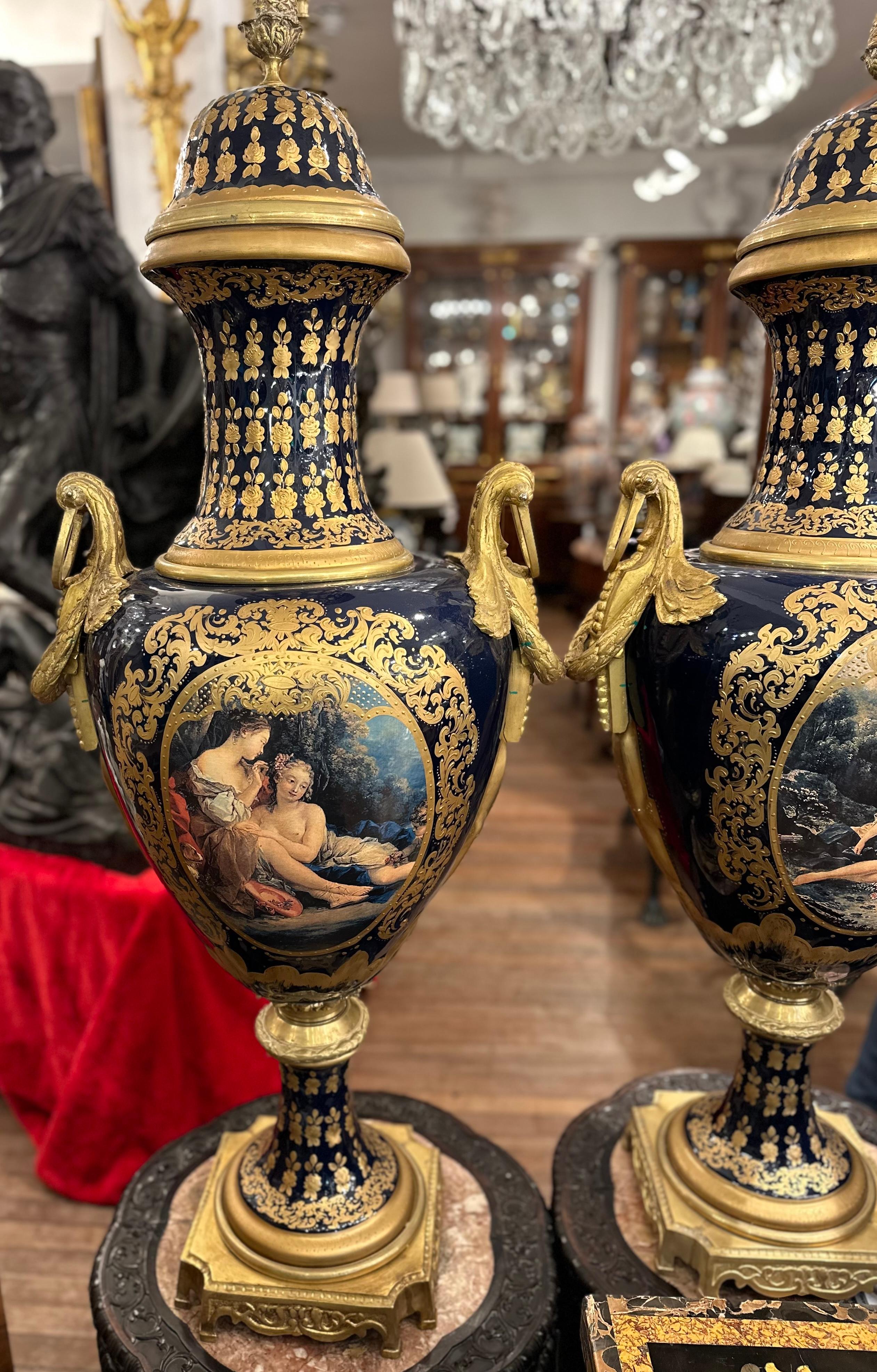 Neoclassical Pair of Sevres Style Blue And Gold Vases For Sale