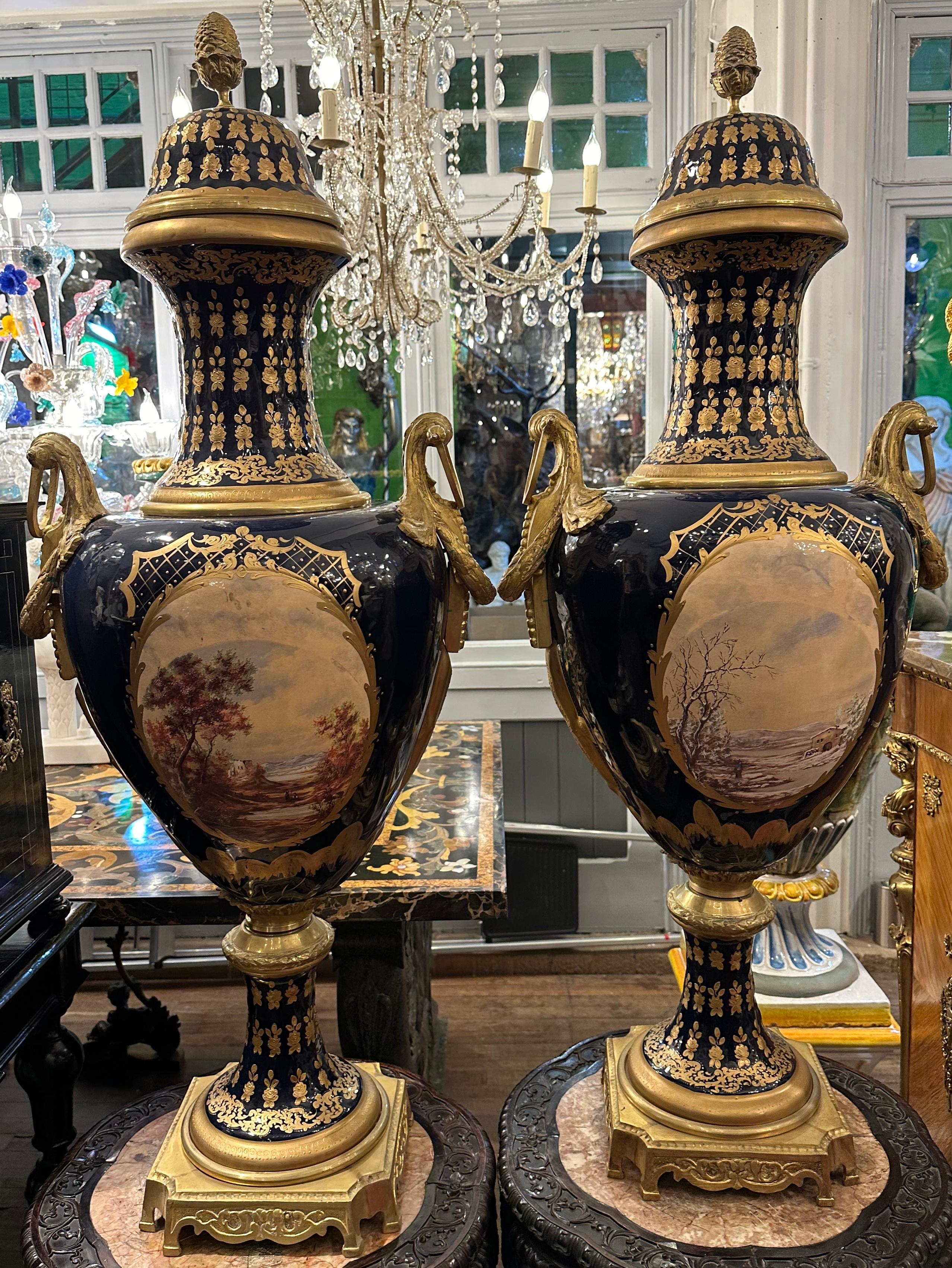 20th Century Pair of Sevres Style Blue And Gold Vases For Sale