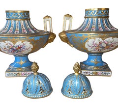 Pair of Sèvres Style Celestial Blue Porcelain Urns. Early 20th Century, France.