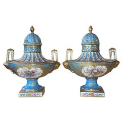 Pair of Sèvres Style Celestial Blue Porcelain Urns. Early 20th Century, France.