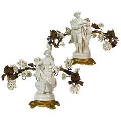 Pair of Sevres Style Figural Blanc de Chine and Gilt Bronze Flower Candelabras