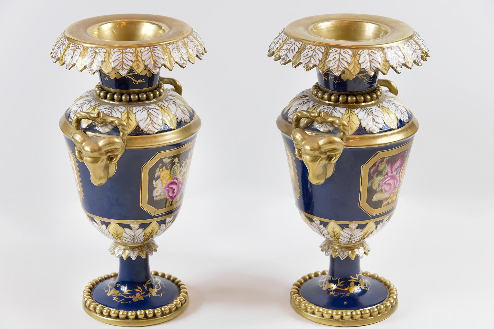 Pair of French Sèvres style cobalt blue porcelain vases decorated with hand painted decor.
