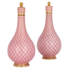 Pair of Sèvres Style Gilt and Pink Porcelain Bottle Vases and Covers