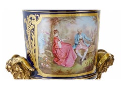 Pair of Sevres Style Gilt and Polychrome Decorated Porcelain Two-Handled Urns
