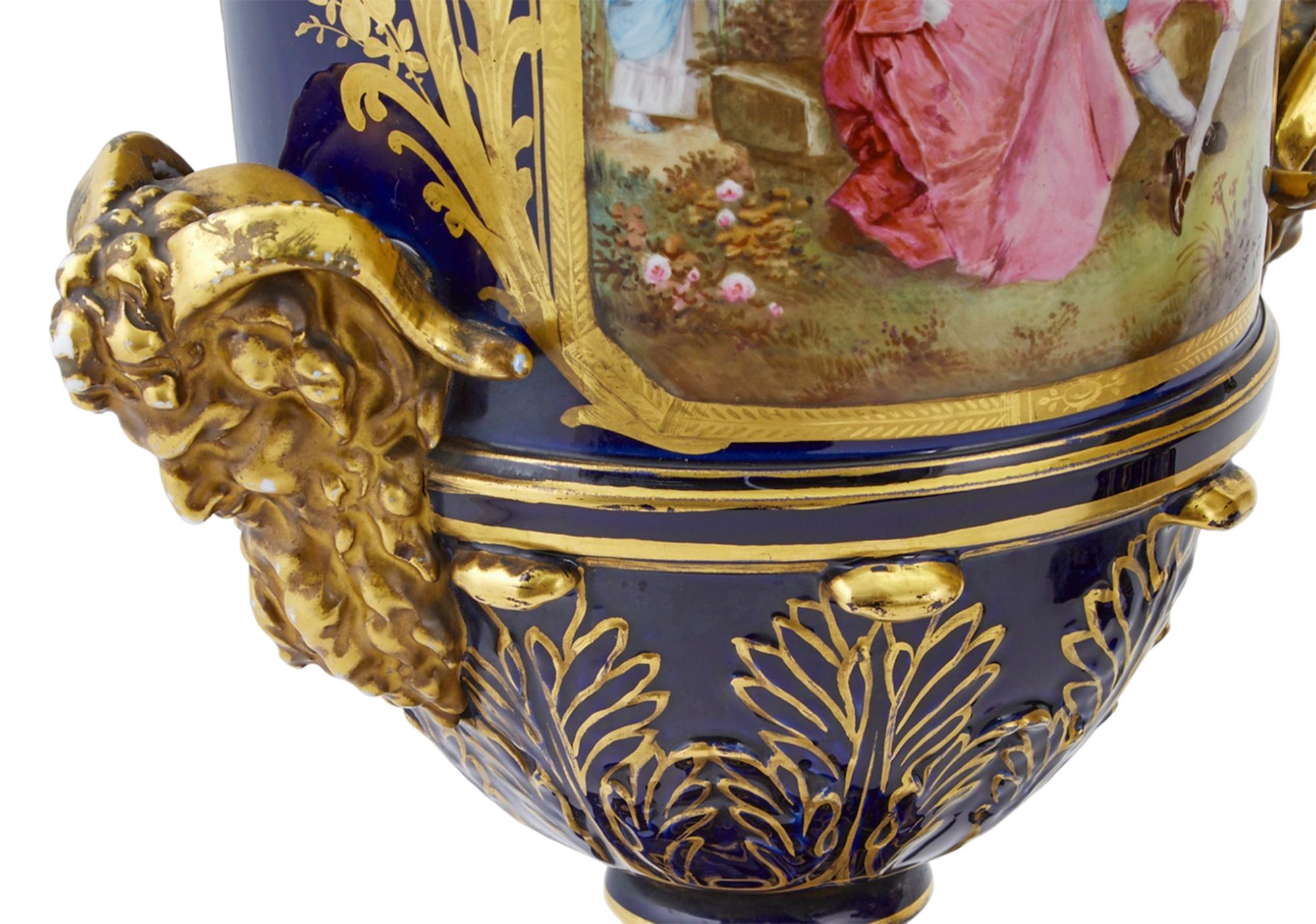 19th Century Pair of Sevres Style Gilt and Polychrome Decorated Porcelain Two-Handled Urns For Sale