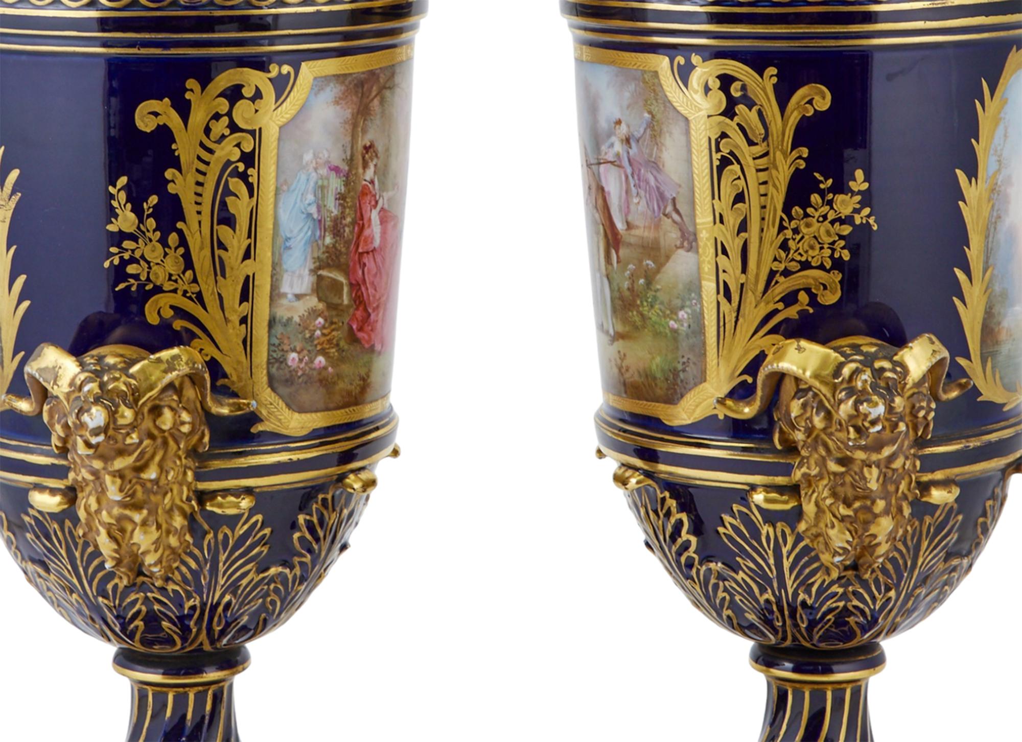 Pair of Sevres Style Gilt and Polychrome Decorated Porcelain Two-Handled Urns For Sale 1