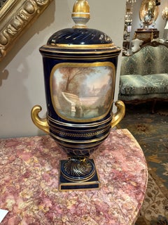 Pair of Sevres urns in cobalt blue hand painted
