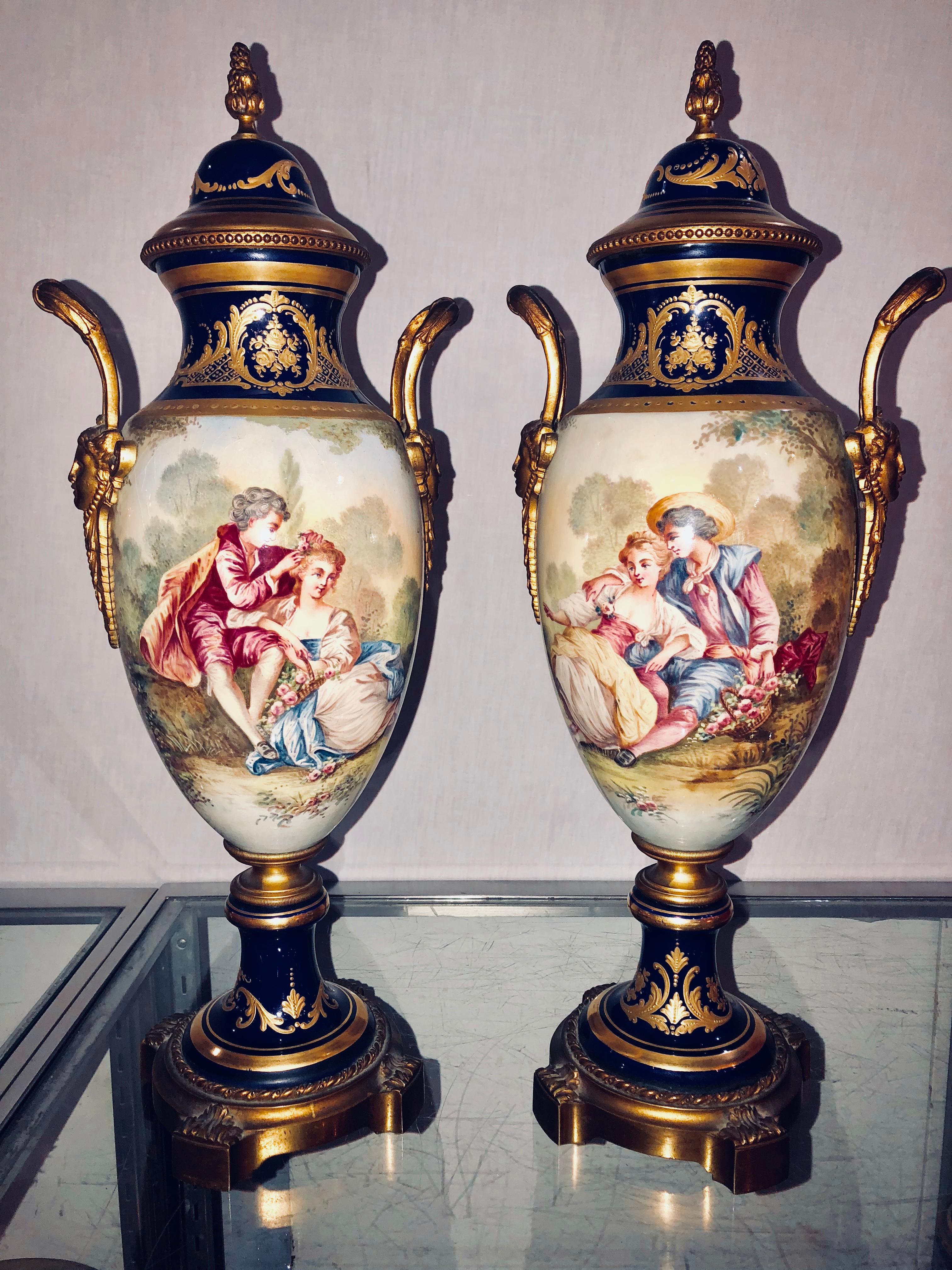 20th Century Pair of Sevres Vases Signed with Bronze Mounts and Masked Handled Sides