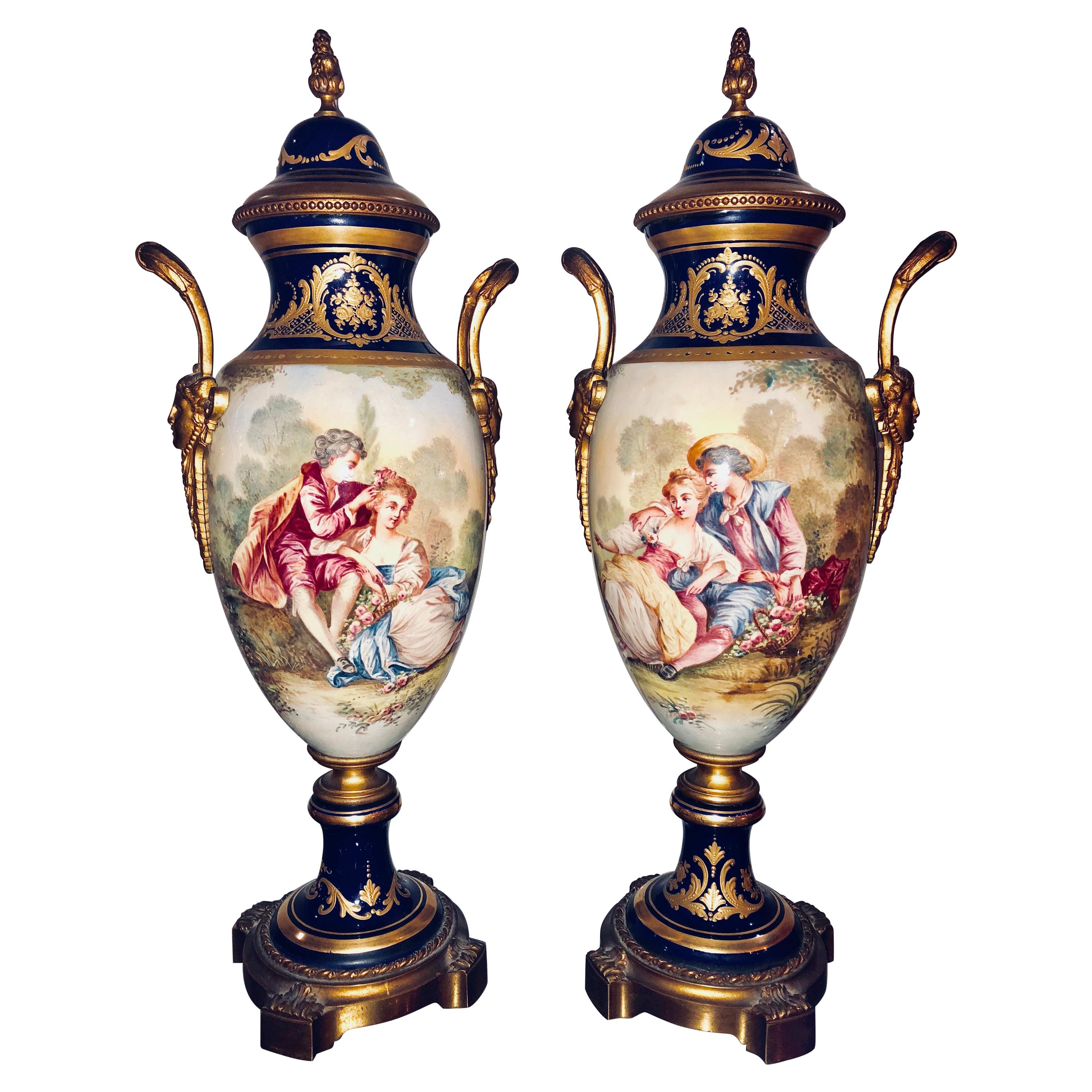 Pair of Sevres Vases Signed with Bronze Mounts and Masked Handled Sides