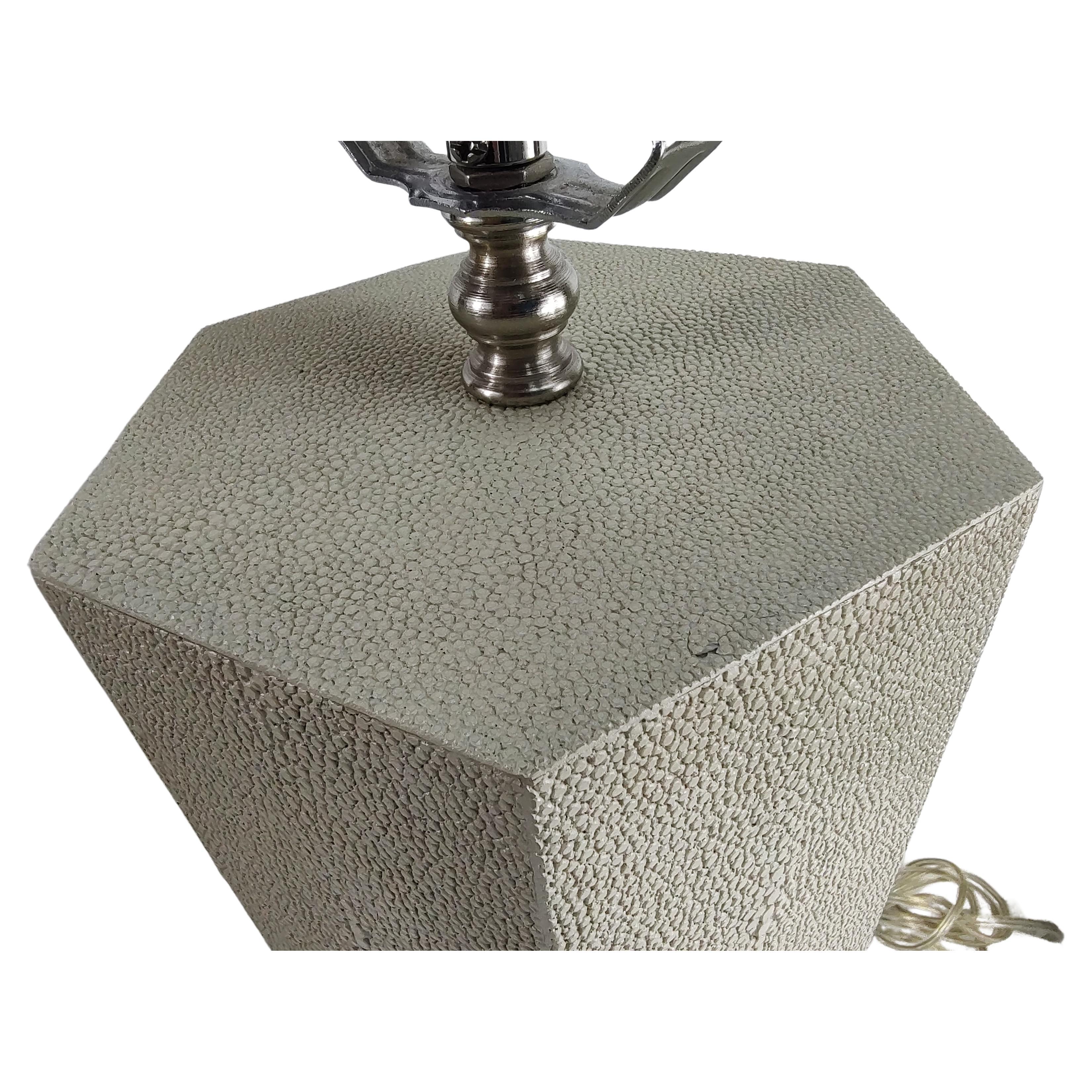 Fabulous pair of Shagreen octagonal table lamps with chrome components. Octagonal in shape and completely covered in Shagreen. In excellent vintage condition with minimal wear. Priced & sold as a pair. Height to socket is 21 inches to top of Finial